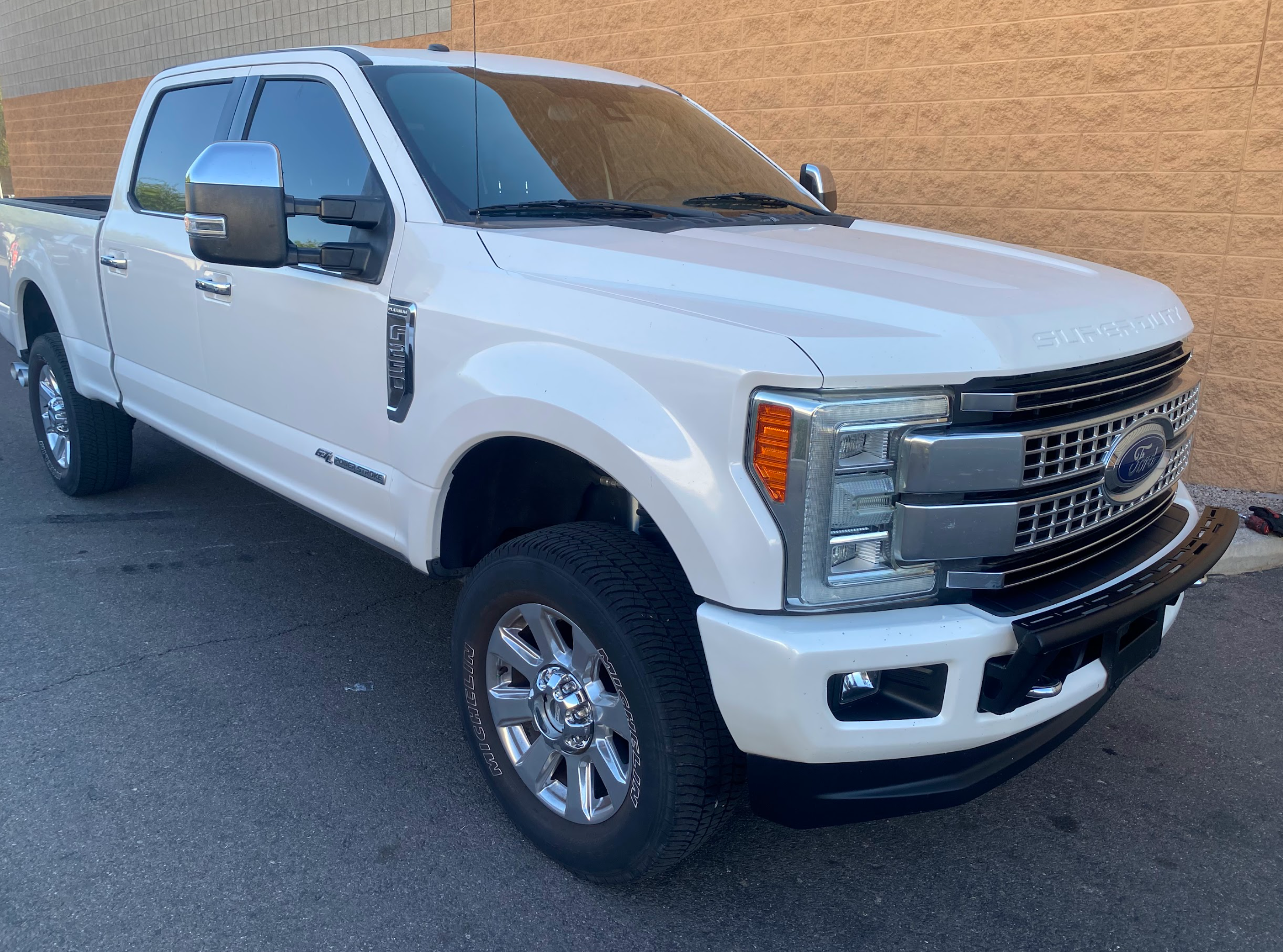2017-2022 Ford F-250 Super Duty with a front light mount kit installed on the stock bumper, showcasing its rugged design.