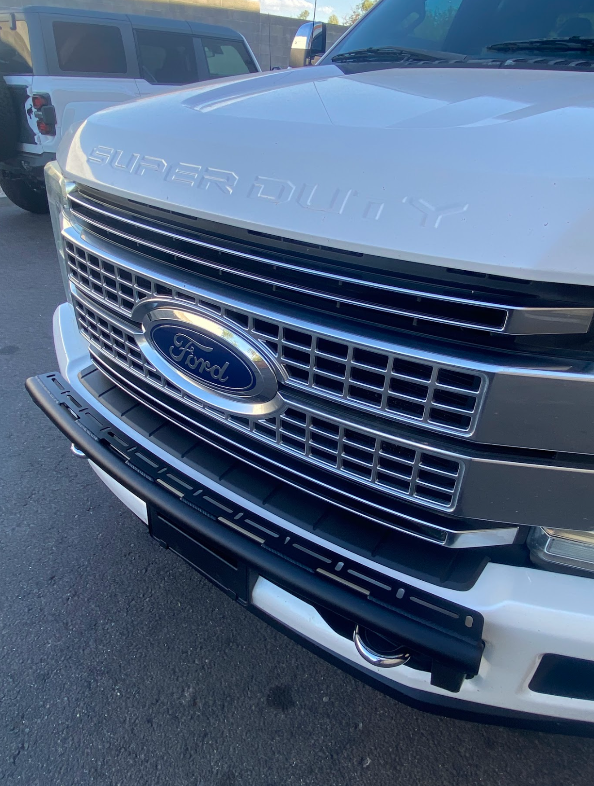 Front light mount kit for 2017-2022 Ford F-250 Super Duty, designed for stock bumpers, showcasing a sleek installation.