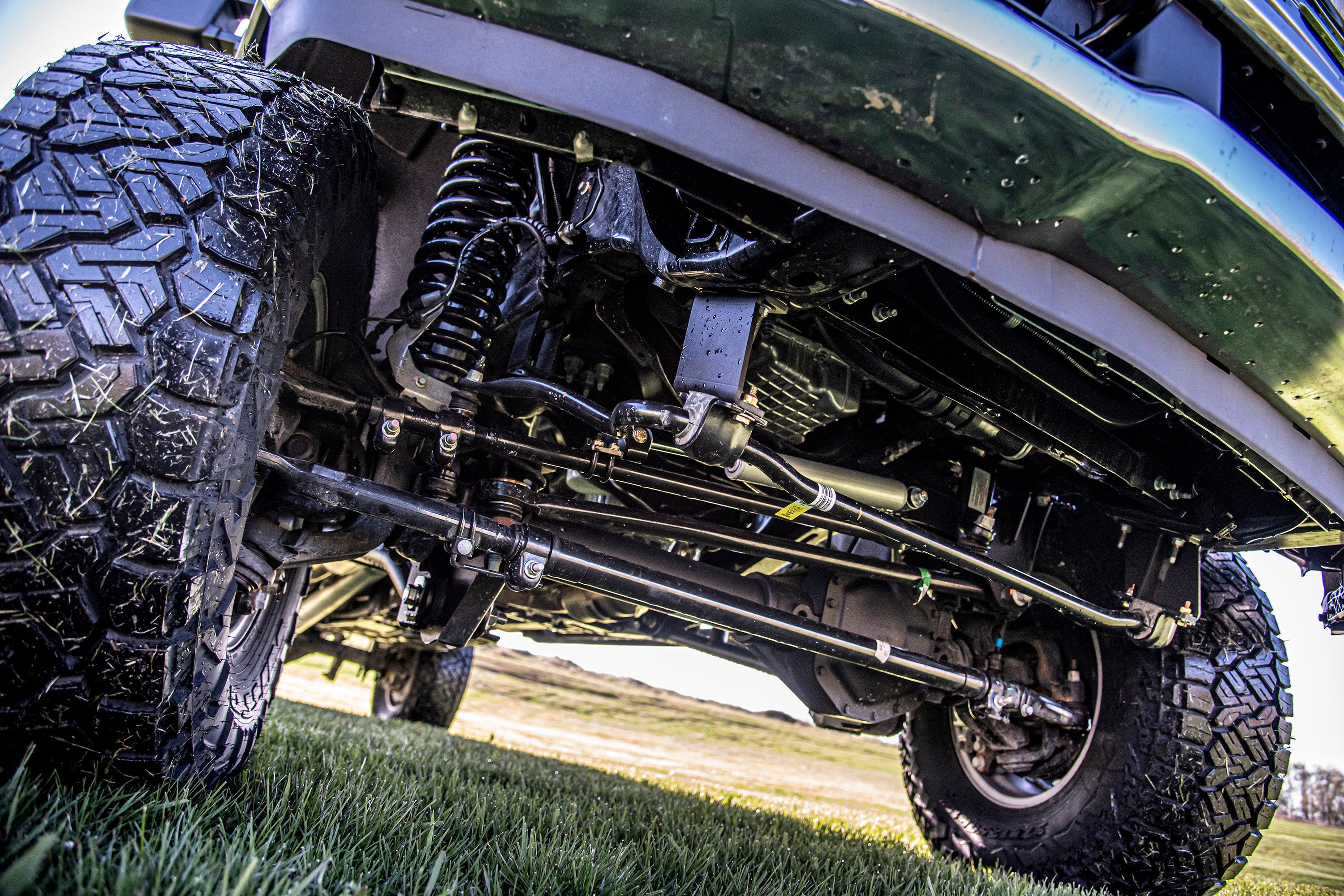 5-inch lift kit with 4-link suspension for Ford F250/F350 Super Duty 4WD, showcasing undercarriage and components.