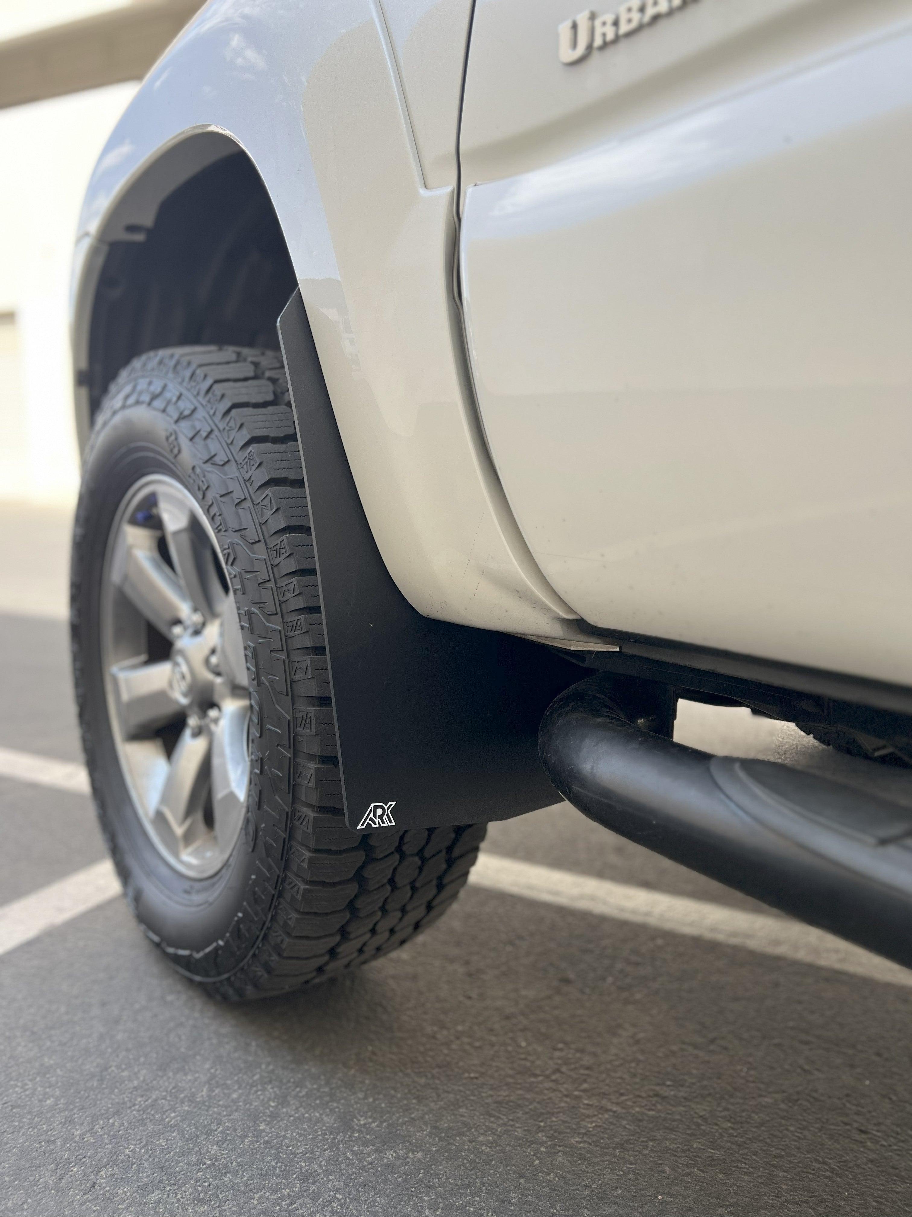 2006-2009 Toyota 4Runner TriXpoly mudflaps installed on a vehicle, showcasing durable protection against mud and debris.