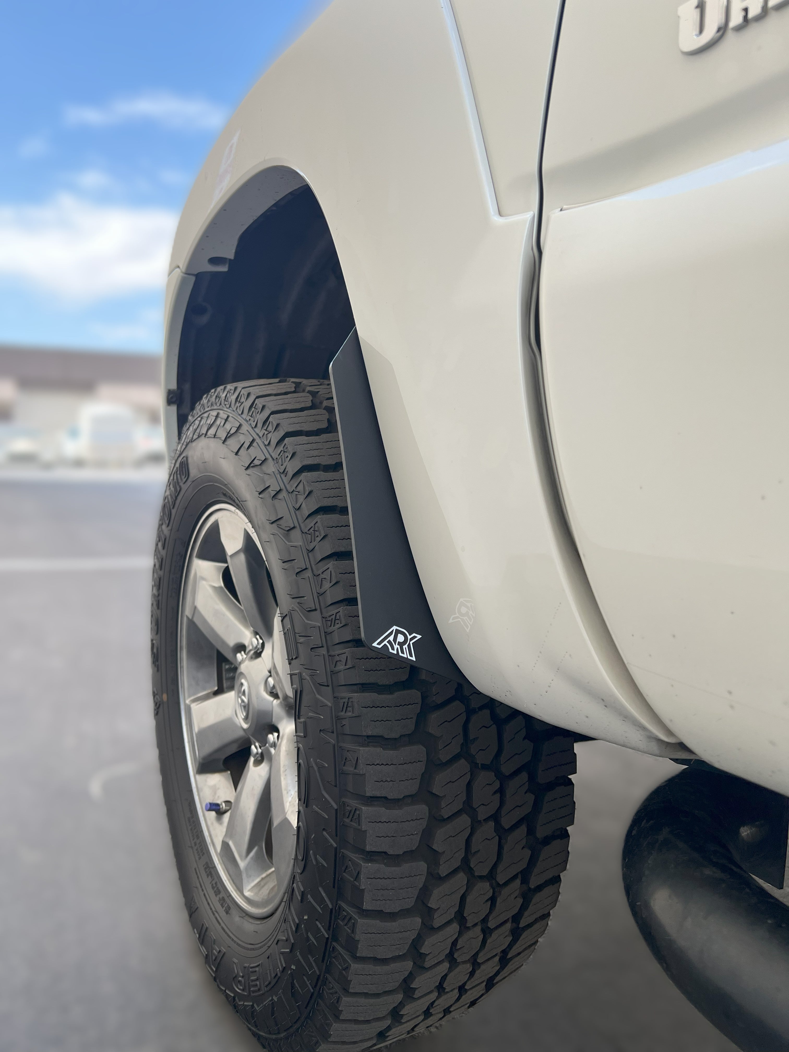 2006-2009 Toyota 4Runner Micro Flare Mud Flap Deletes installed on a vehicle, showcasing rugged tires and sleek design.