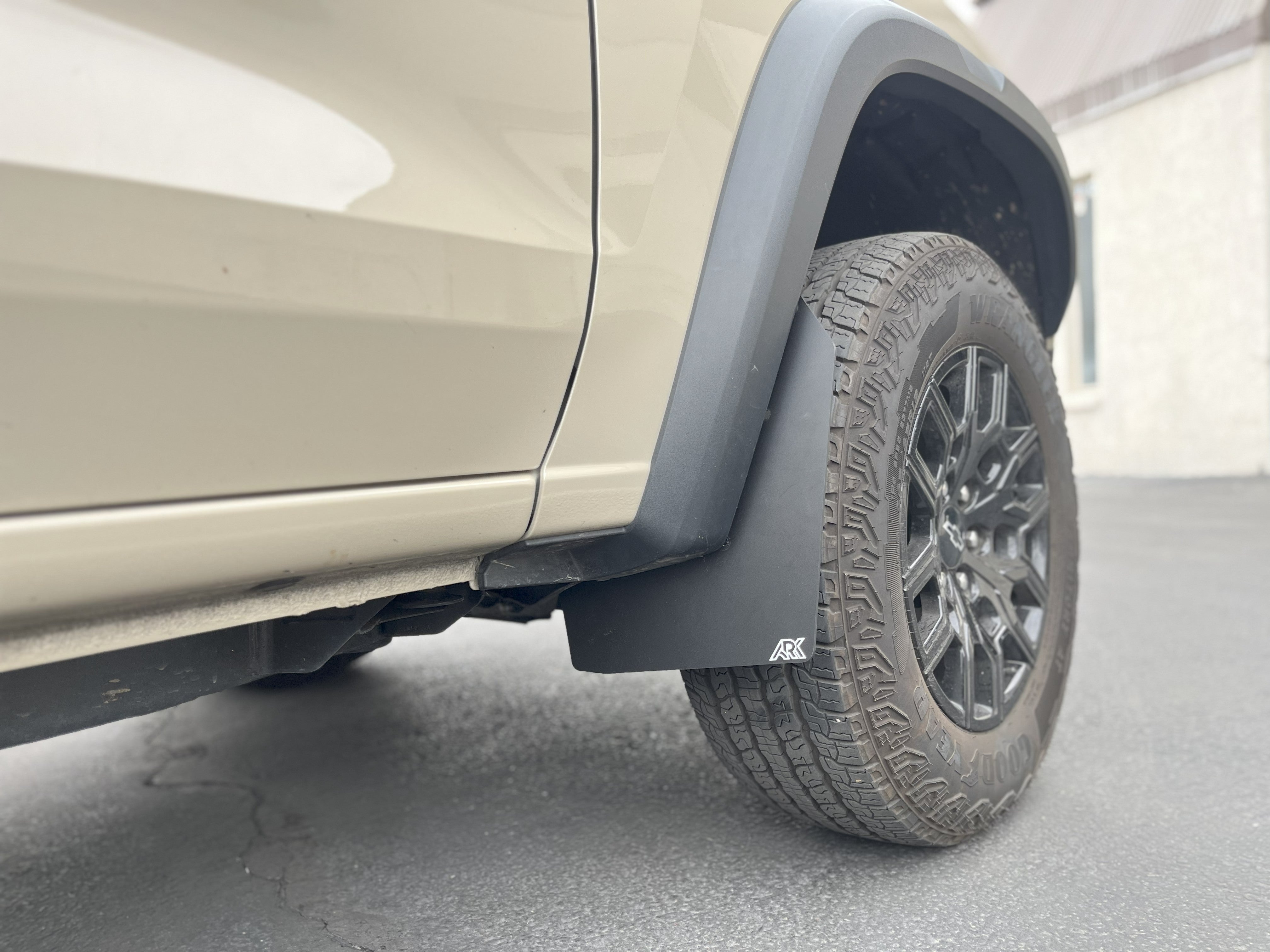 2023+ Chevy Colorado ZR2/Trailboss TriXPoly Mid Mudflaps installed on a vehicle, showcasing rugged design and tire protection.