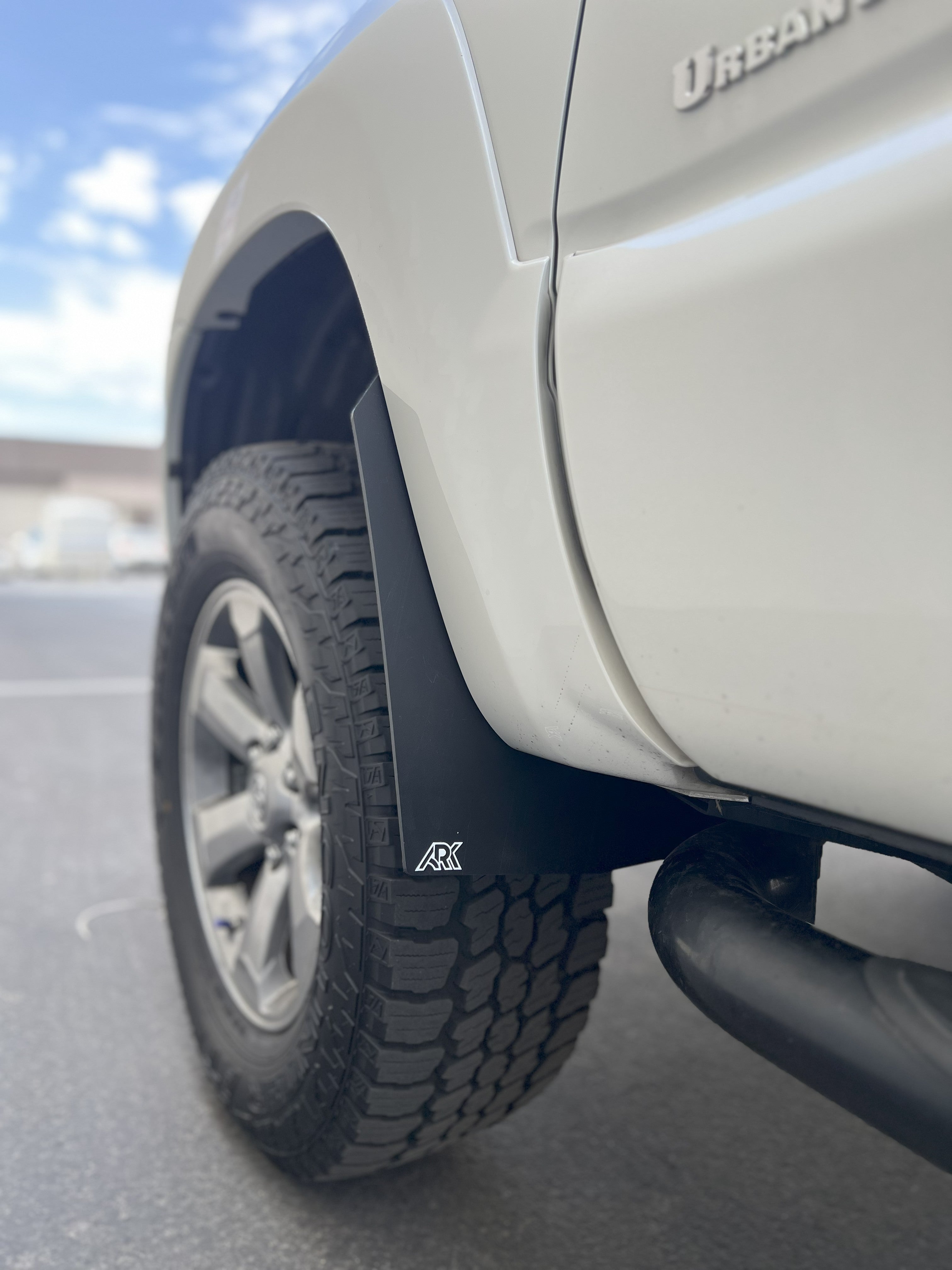 2006-2009 Toyota 4Runner TriXpoly Mid-Mudflaps installed on a vehicle, showcasing rugged design and tire protection.