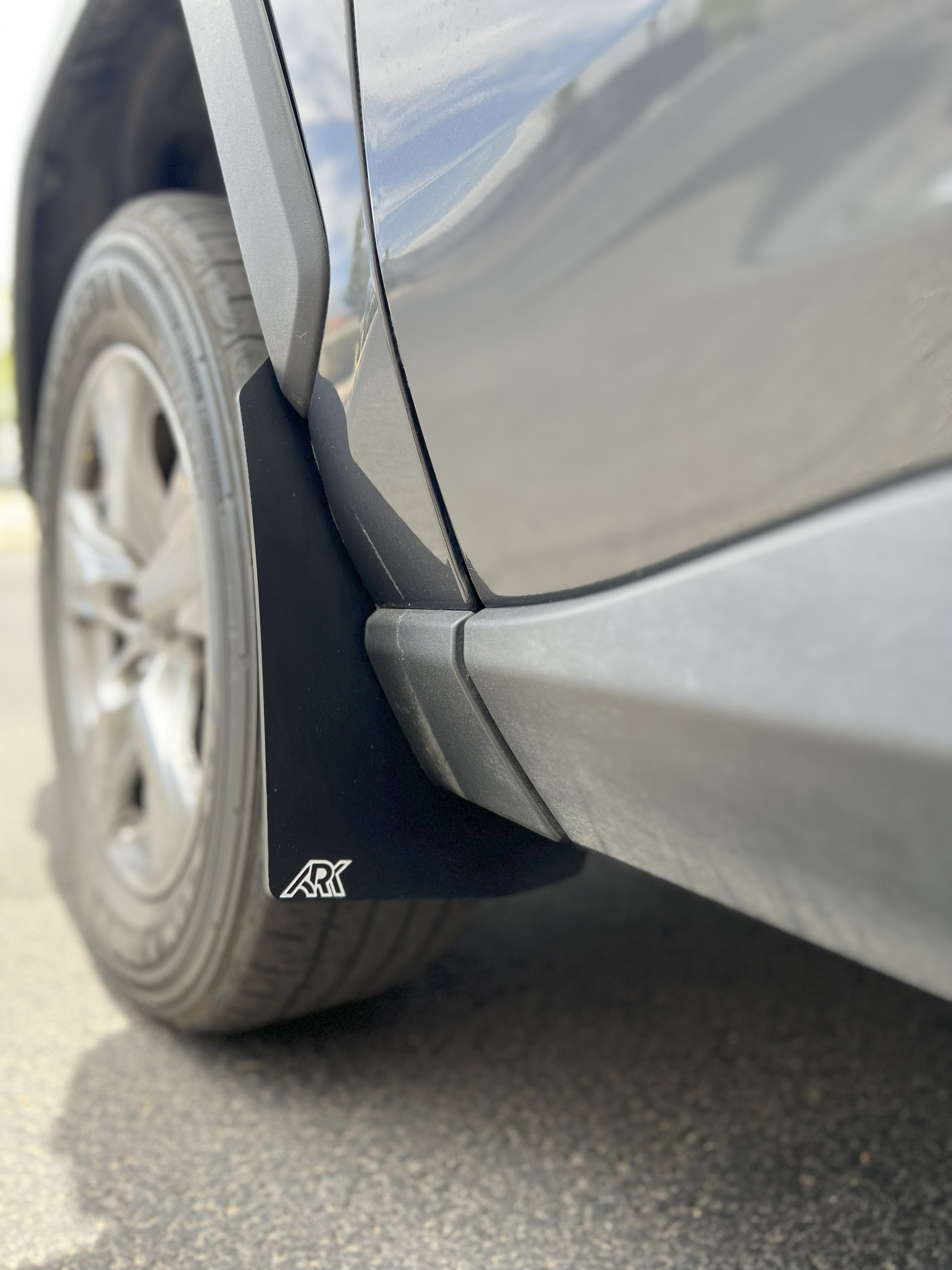 2019-2025 Toyota RAV4 Gen 5 TriXPoly Mid Mudflaps installed on a vehicle, providing protection from mud and debris.