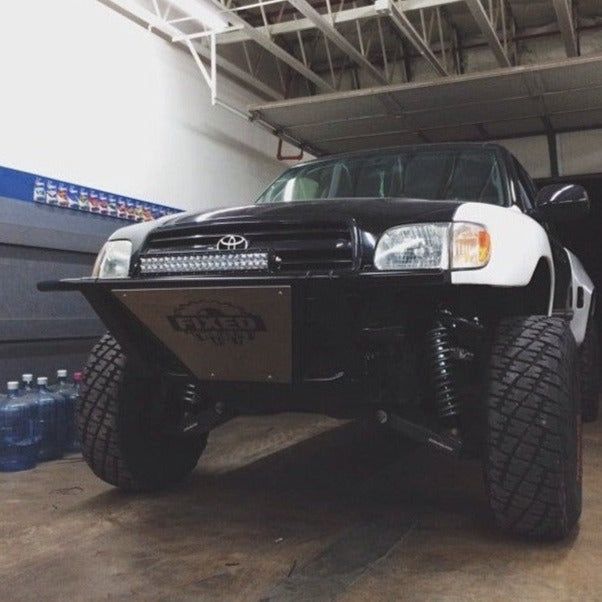 2000-2006 Toyota Tundra fenders showcased on a modified truck with offroad tires and a custom front bumper.