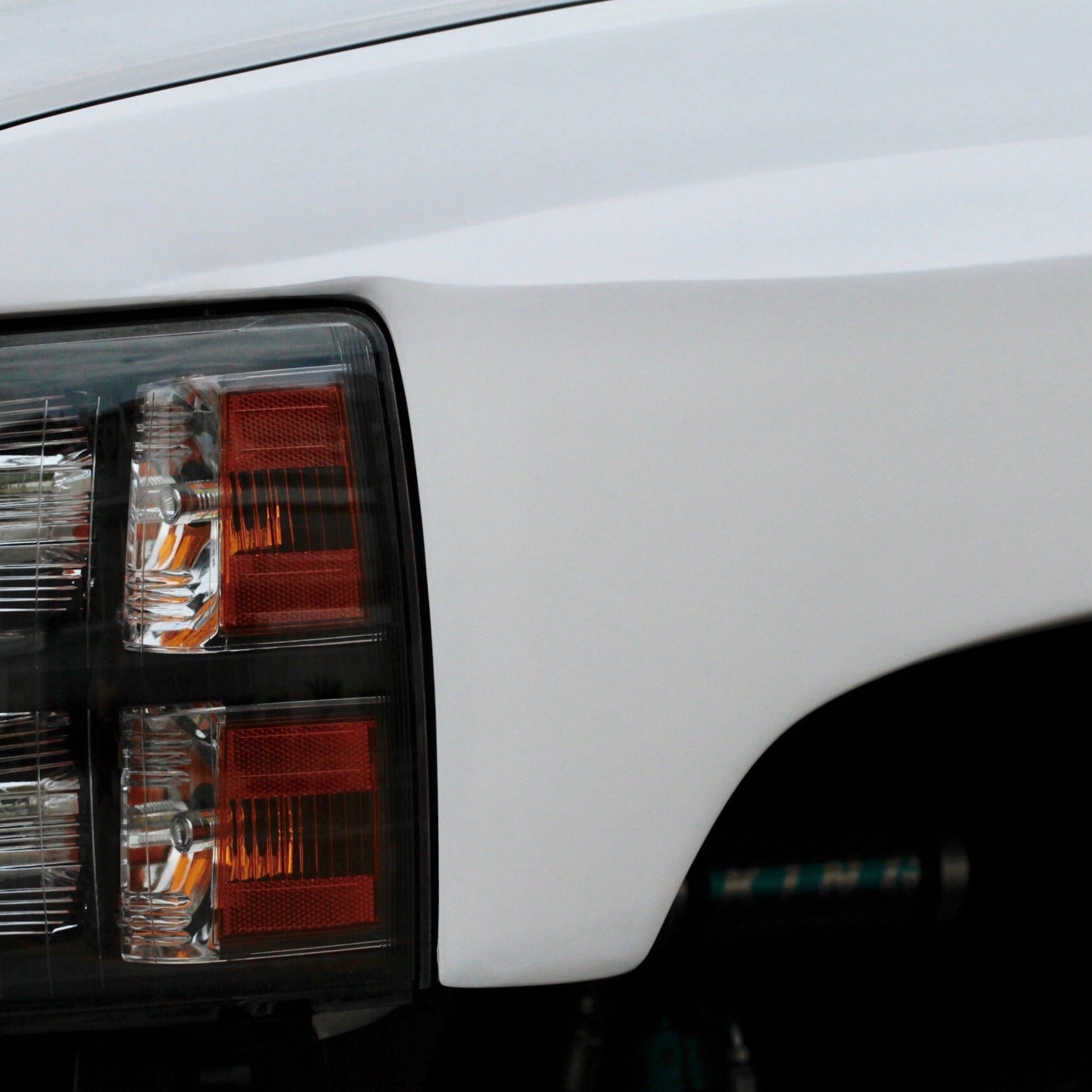 2007-2013 Chevrolet Silverado fender showcasing a sleek design and integrated headlight for enhanced vehicle aesthetics.