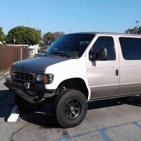1992-2007 Ford Econoline Van with aftermarket fenders, showcasing a rugged offroad style and enhanced durability.