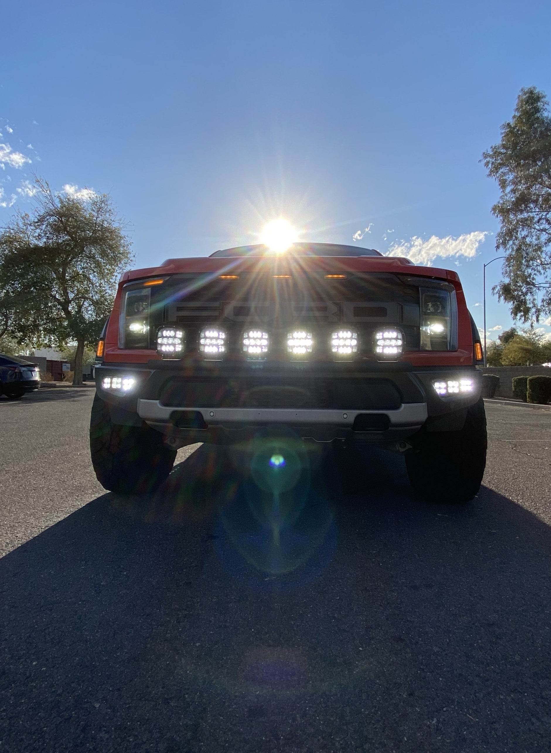 2024 Raptor Front Light Mount Kit on a truck, showcasing multiple lights on a modular bumper for enhanced visibility.