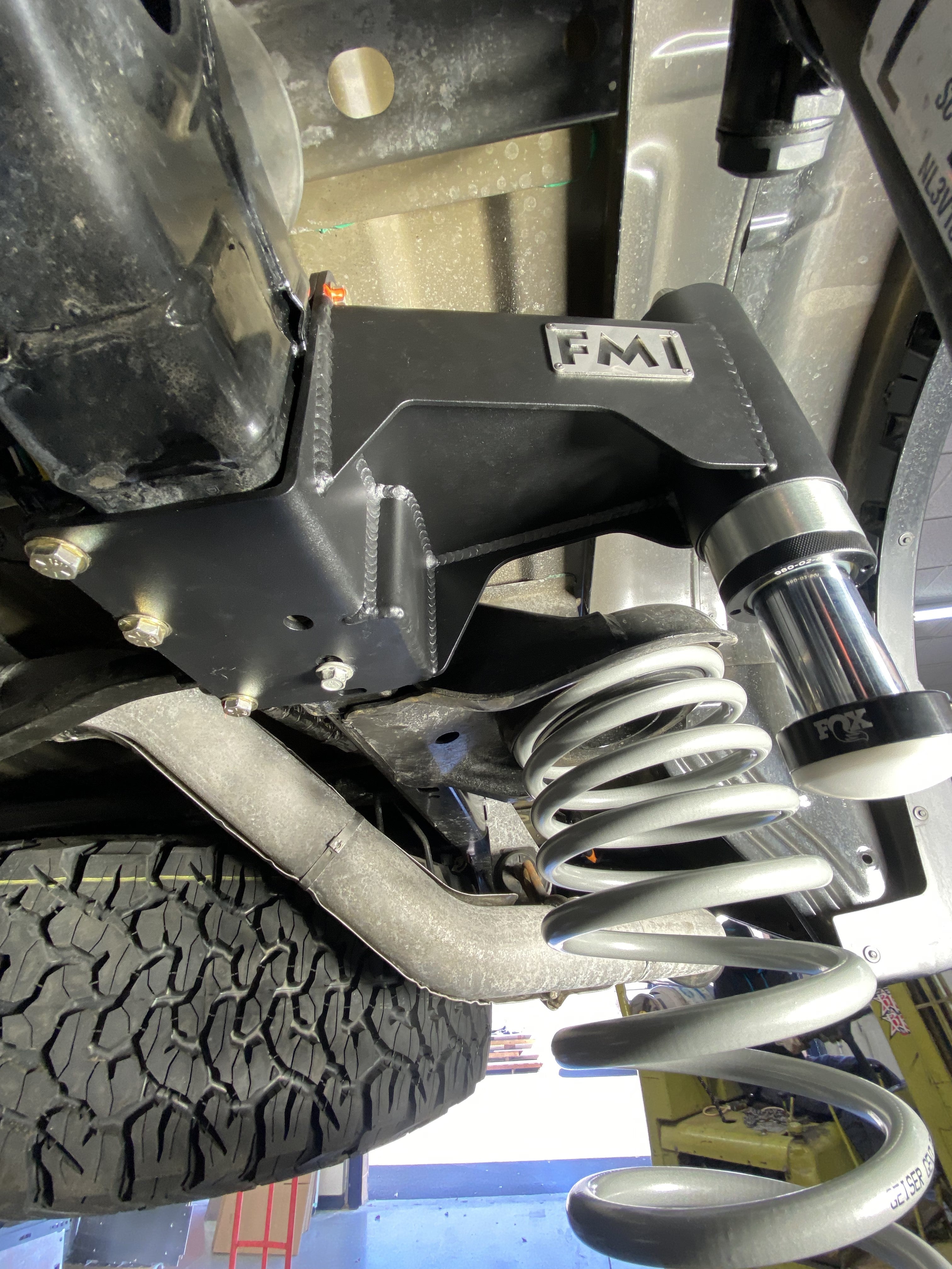2021-2024 Ford Raptor rear bump stop kit installed, showcasing durable construction and suspension components.
