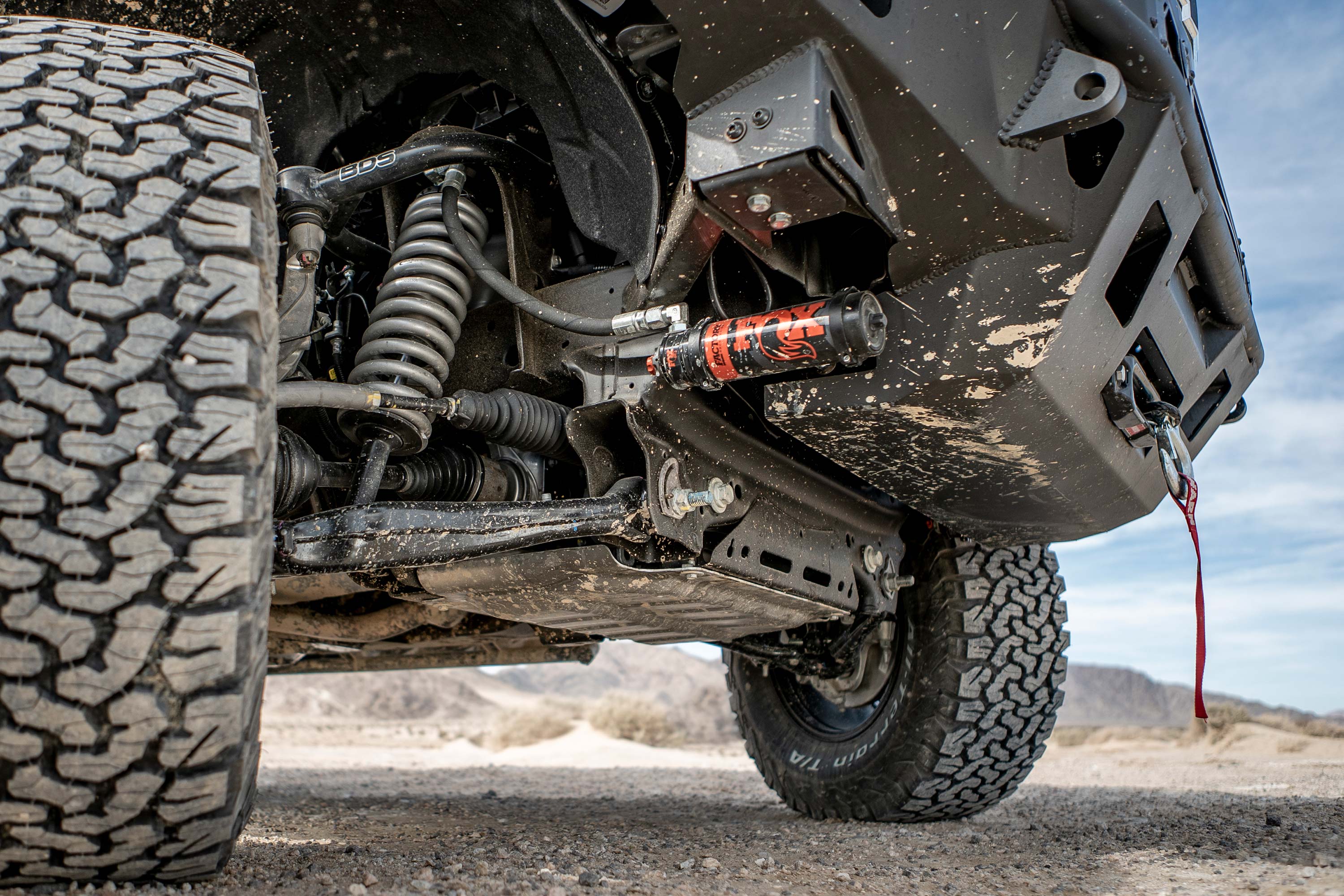 1.5-inch lift kit and FOX 2.5 Performance Elite coil-over installed on a Chevy Trail Boss or GMC AT4 1500, showcasing offroad suspension.