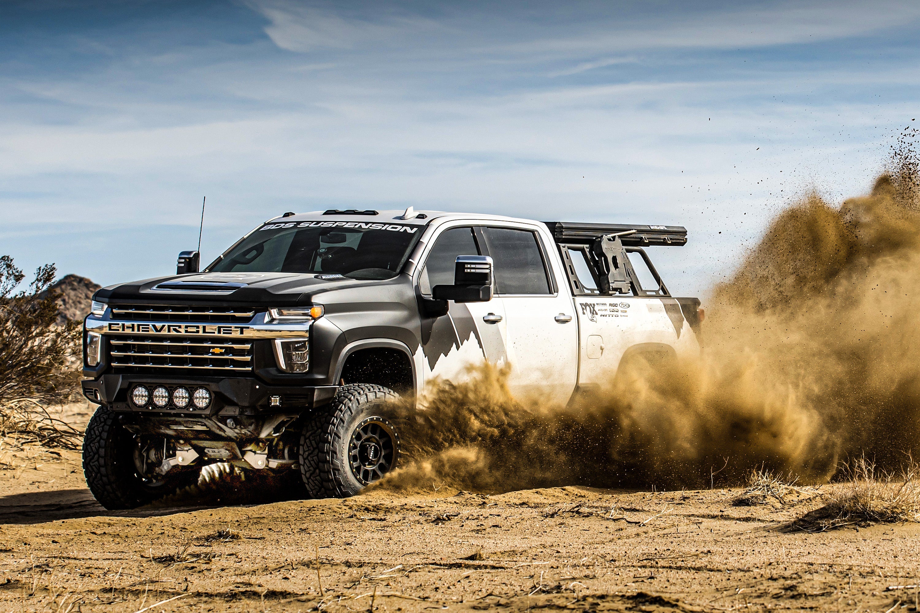 6.5-inch lift kit for Chevy Silverado or GMC Sierra 2500HD/3500HD, featuring FOX 2.5 coil-over conversion, off-road performance.