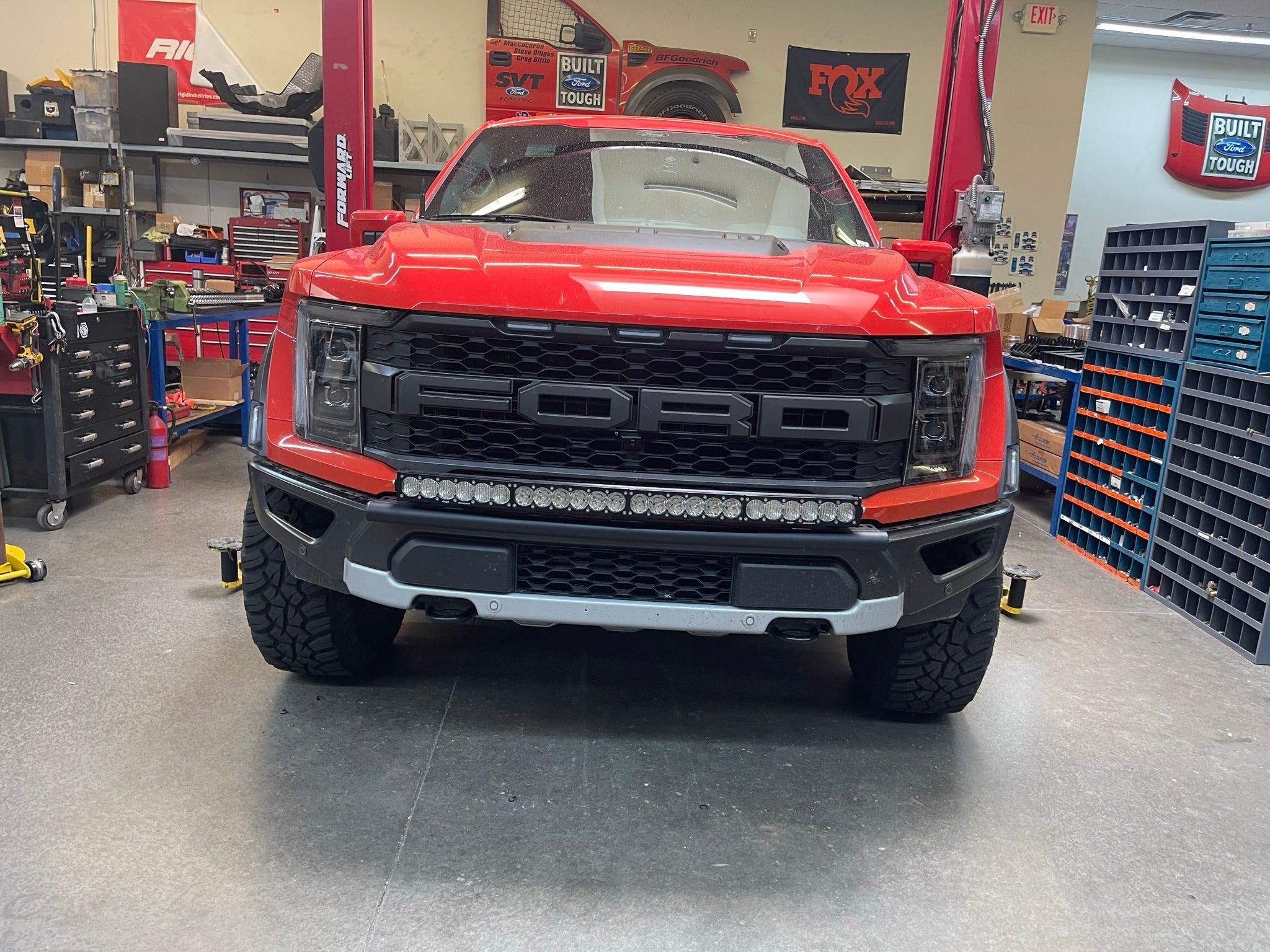 2024 Raptor Front Light Mount Kit for modular bumpers, showcasing a red Ford truck with customizable light options.