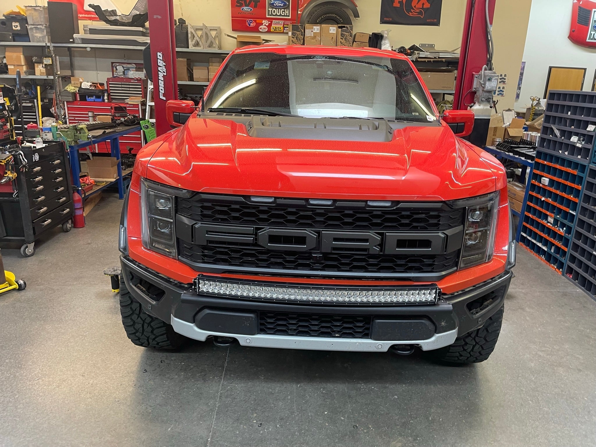 2024 Raptor Front Light Mount Kit for modular bumpers, showcasing a red truck with customizable light options.