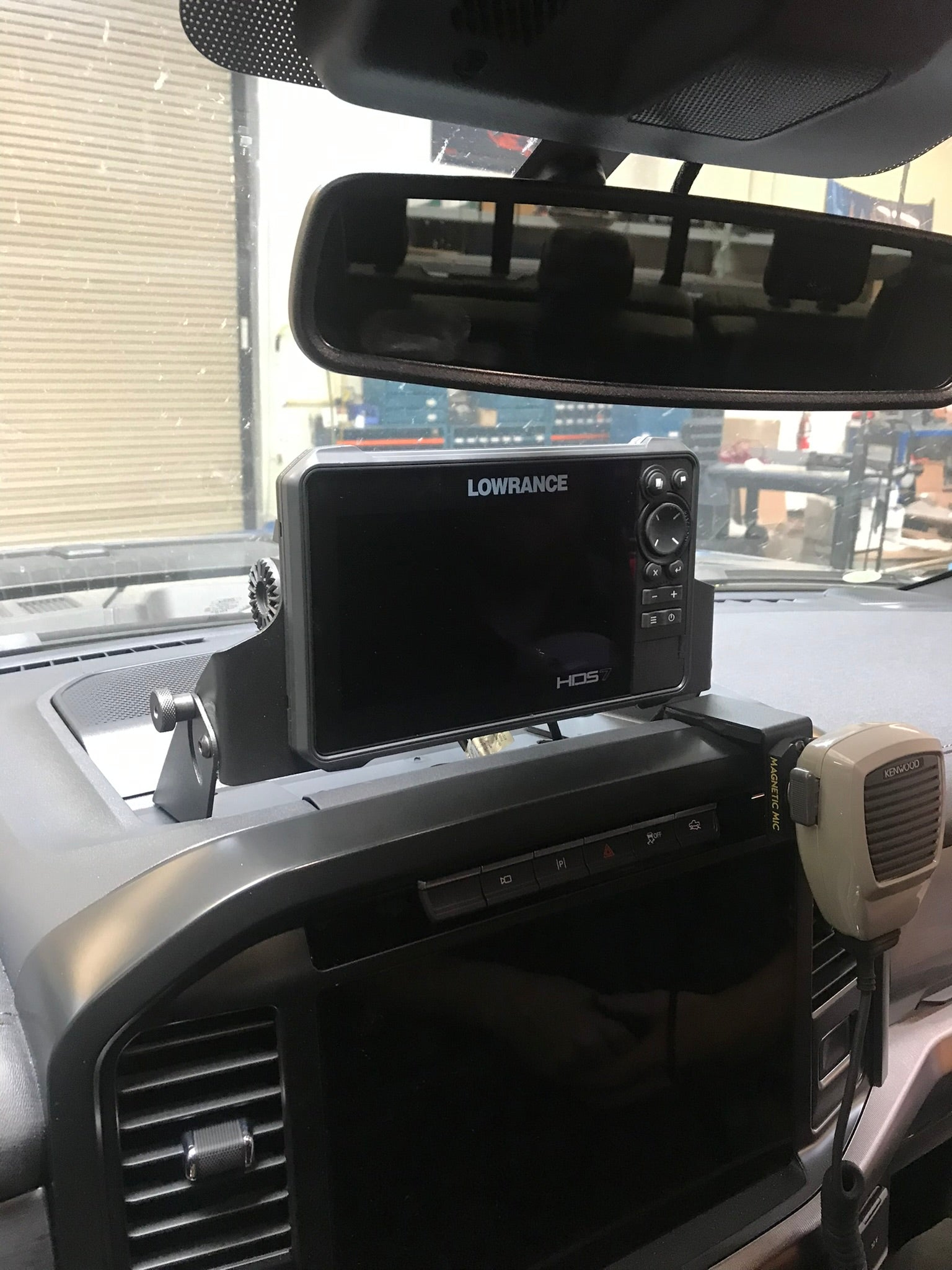 Center dash fold-down GPS mount for 2021-2024 F150 and Gen 3 Raptor, featuring a Lowrance HDS7 Live display.