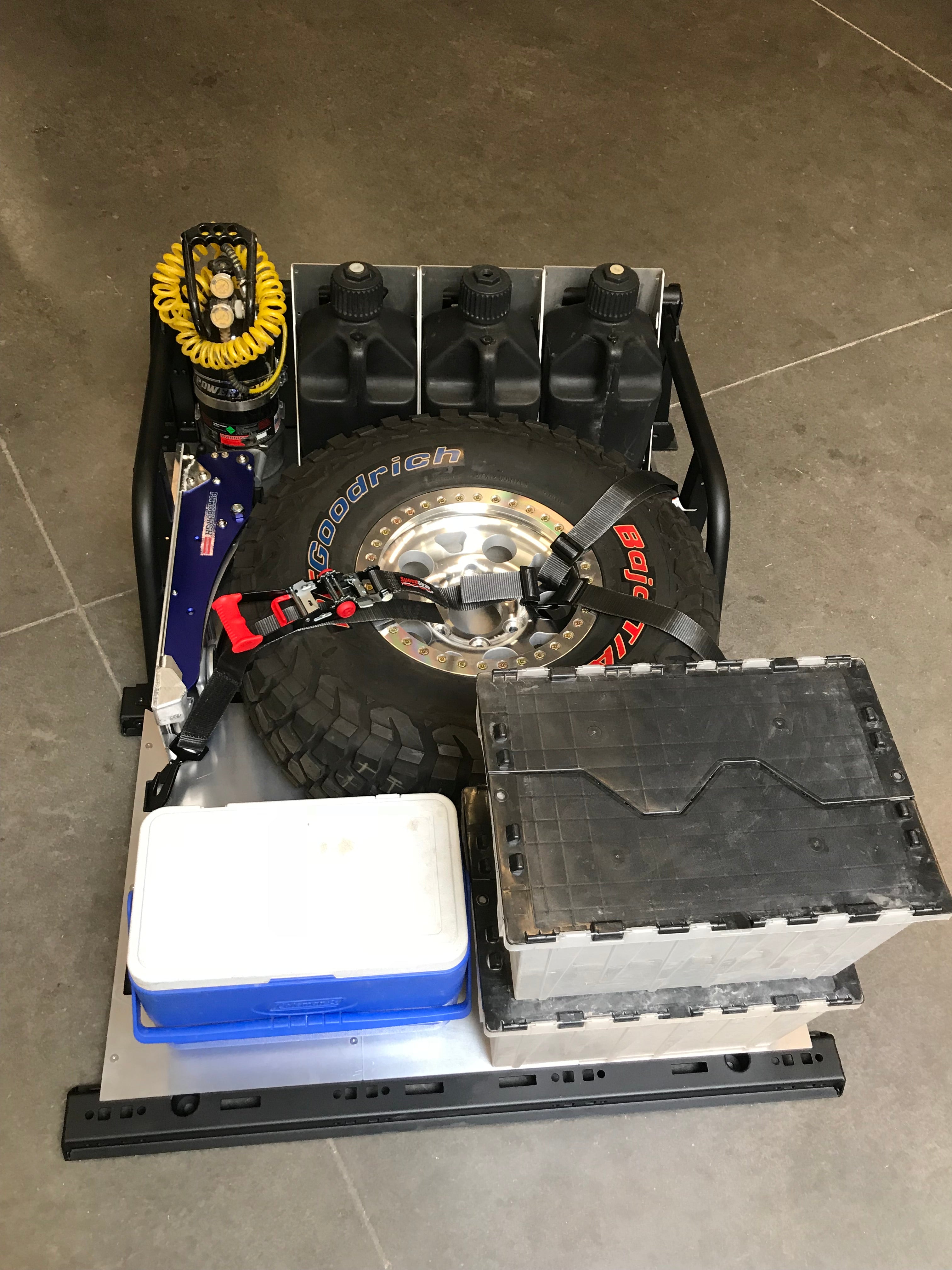 Modular bed organizer for 2017-2024 Ford Raptor and F150, featuring storage for tools, gear, and a spare tire.