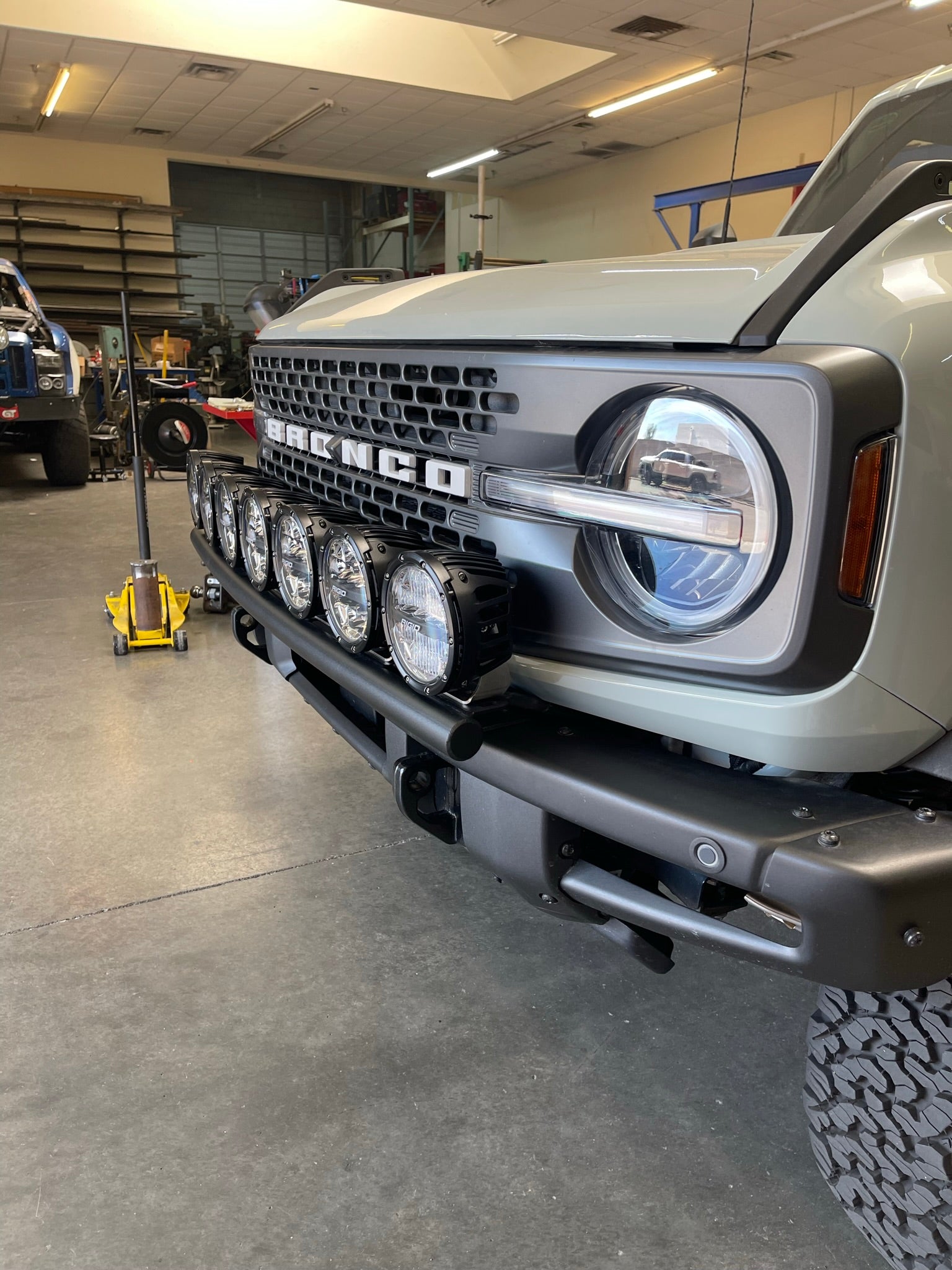 Front light mount kit for 6th Gen Bronco's modular stock bumper, showcasing multiple lights for enhanced visibility.