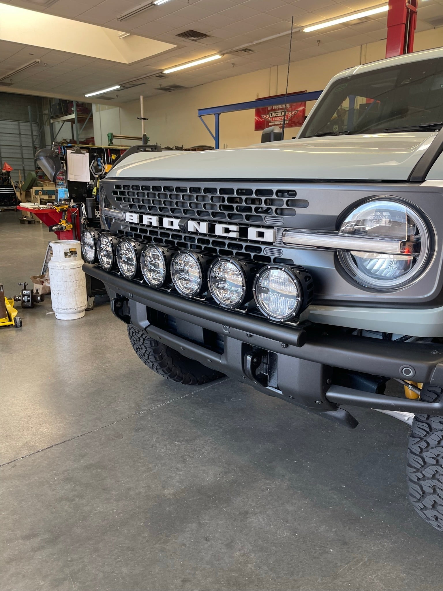 Front light mount kit for 2022-UP Bronco Raptor, featuring multiple lights for enhanced visibility and off-road performance.