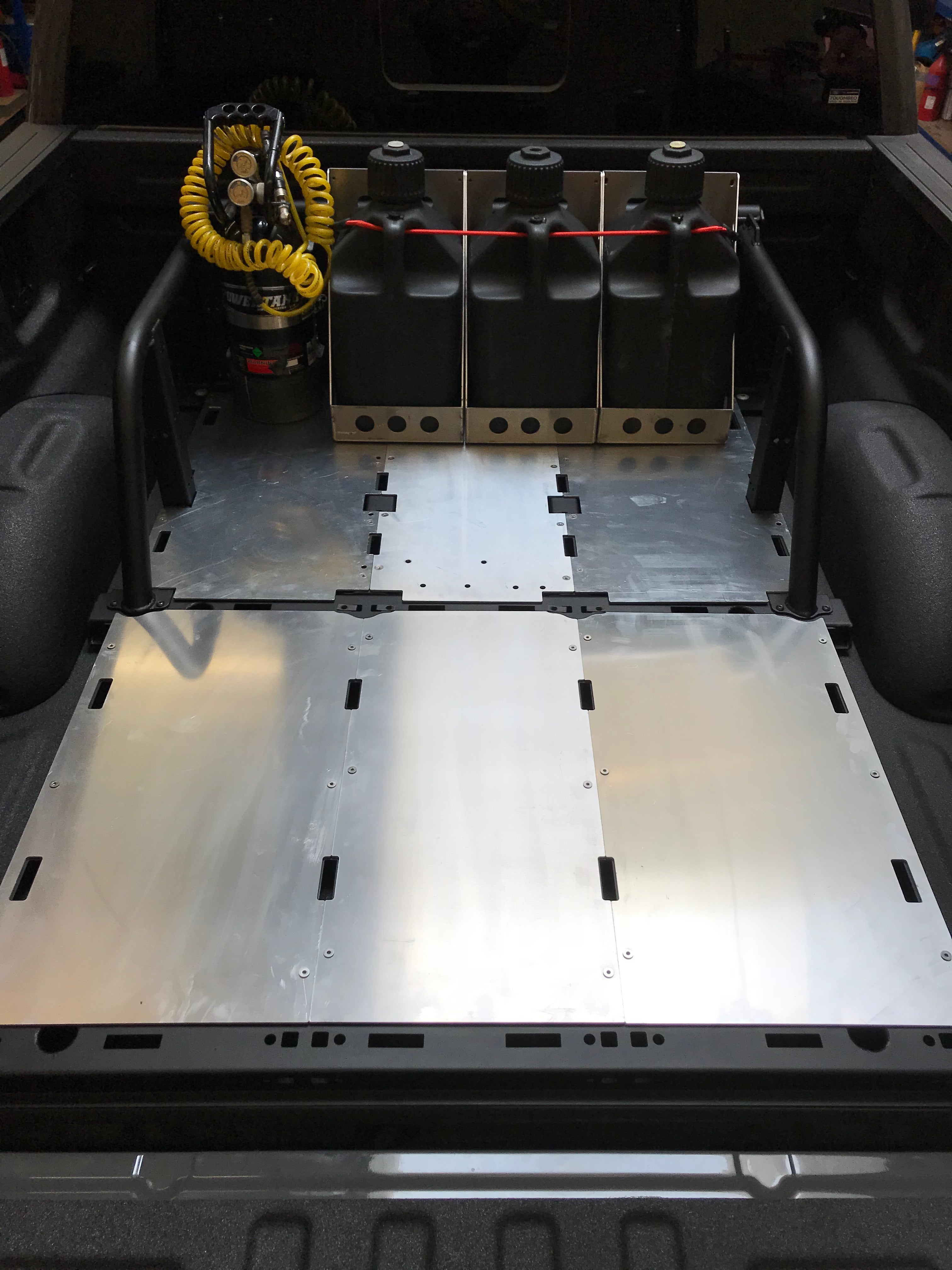 Modular bed organizer for 2017-2024 Ford Raptor and F150, featuring storage for tools and equipment in the truck bed.