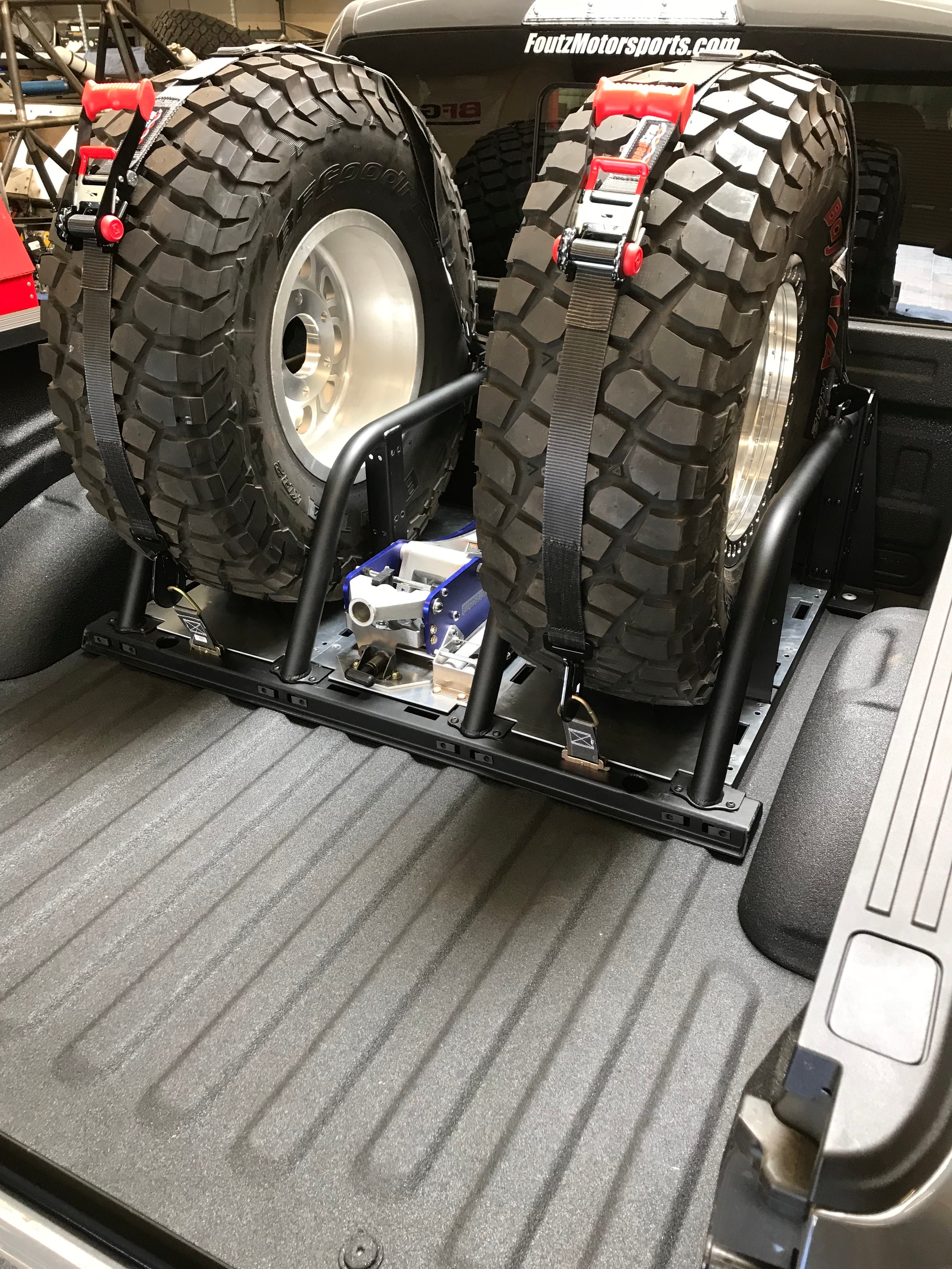 2021+ Raptor 5-Link Rear Bed Organizer for 3.0x16 Coil Over or 3.5x16 Bypass Shock with secured spare tires in truck bed.
