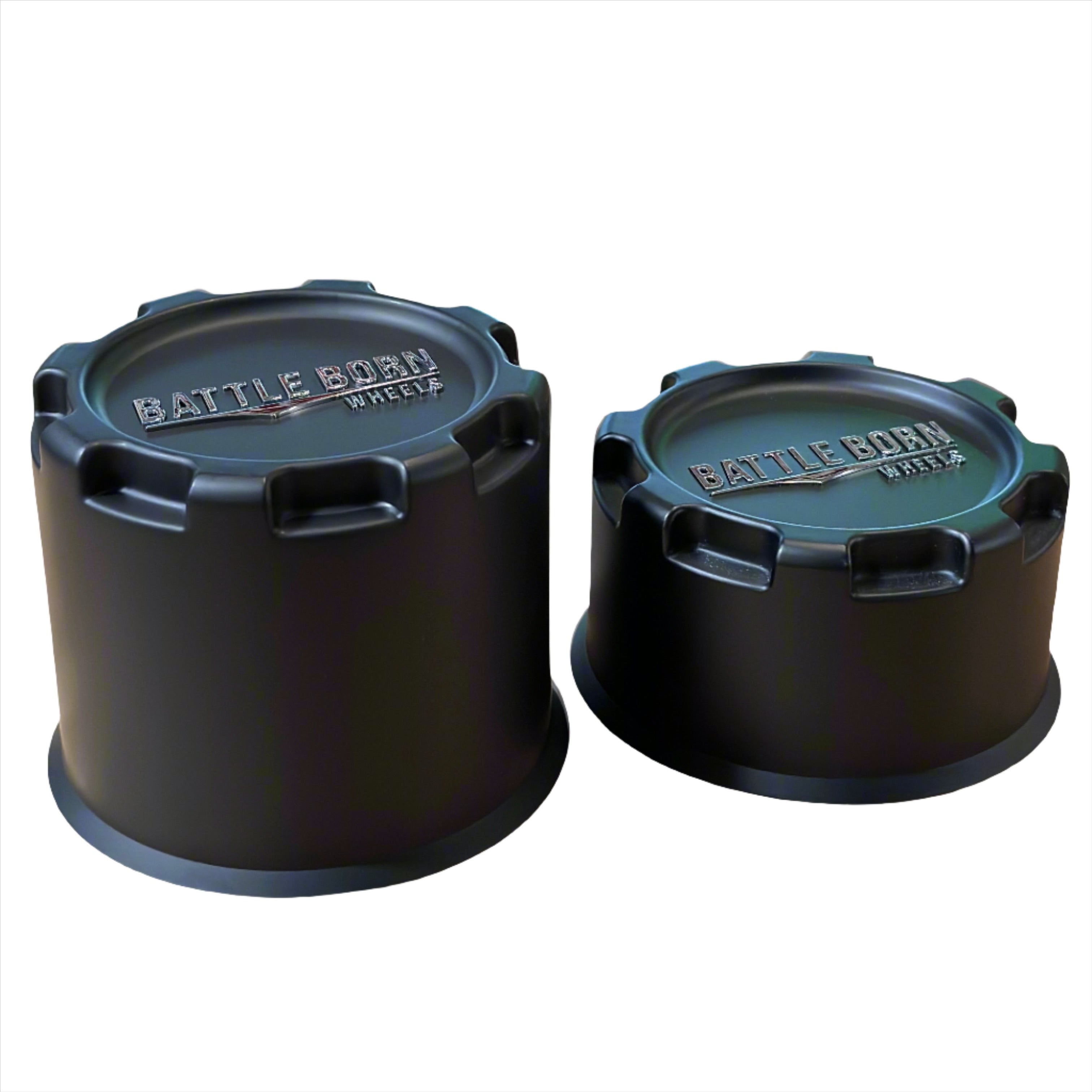 Black 8 lug plastic center caps with "Battle Born Wheels" embossed logo, designed for trucks and SUVs.