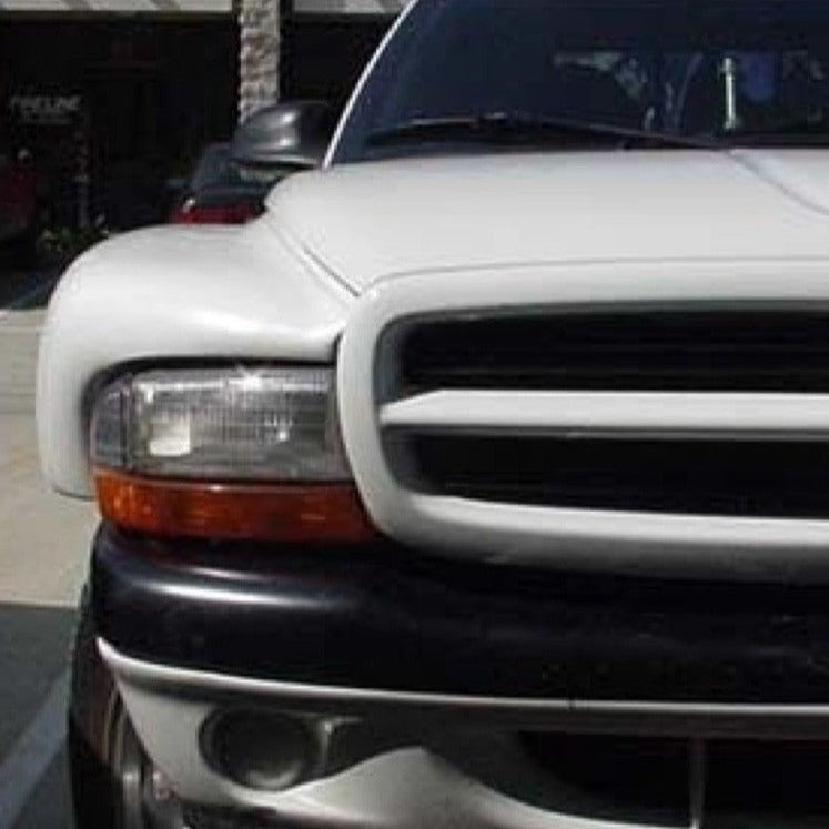 Front view of a 1997-2004 Dodge Dakota showcasing aftermarket fenders designed for enhanced durability and style.