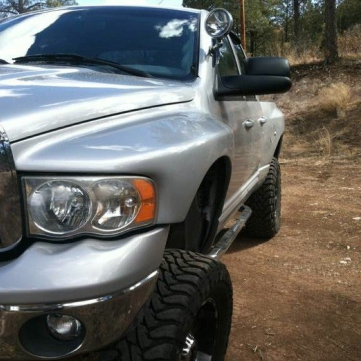 2003-2005 Dodge Ram fenders installed on a silver truck, showcasing an offroad-ready appearance and rugged design.