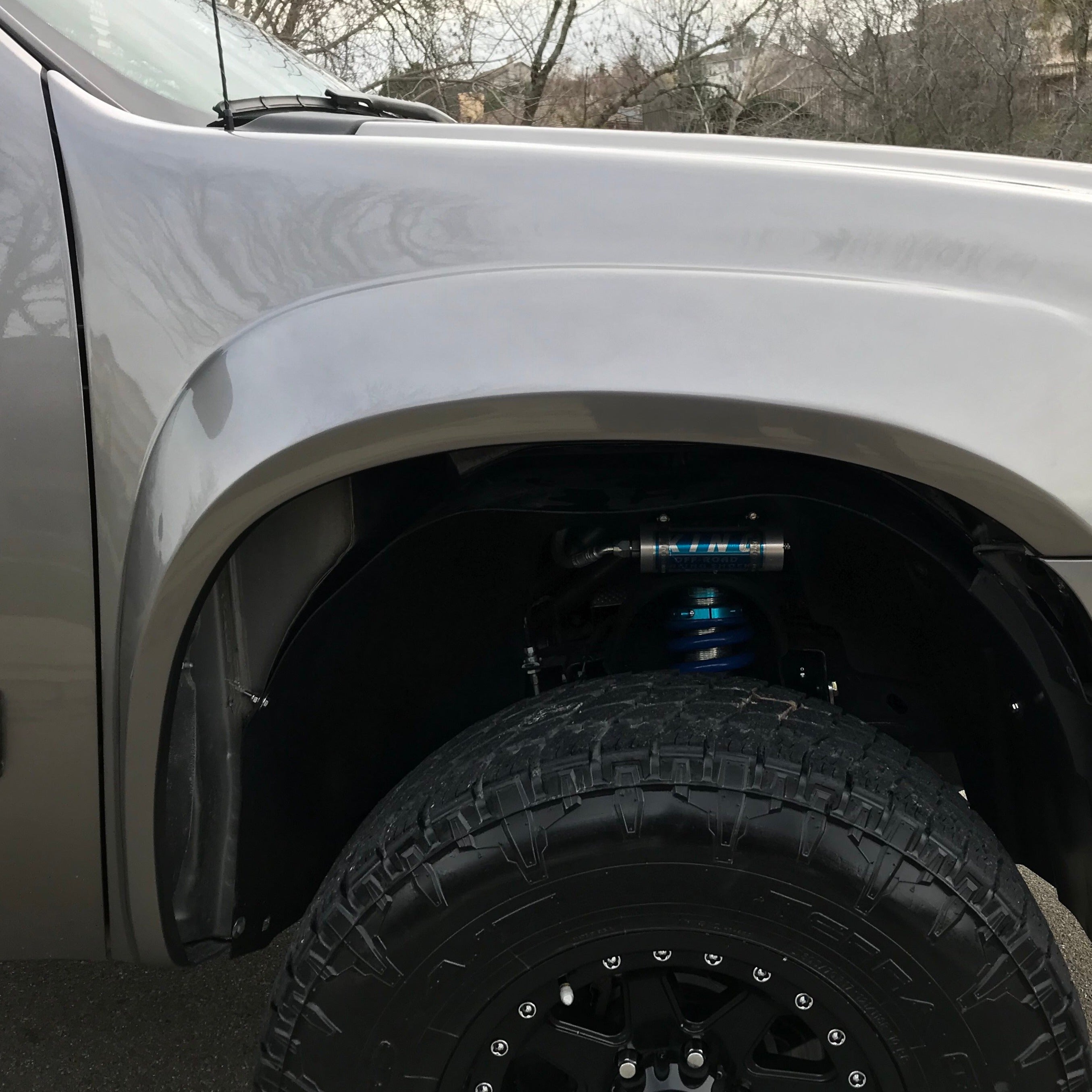 2007-2013 GMC Sierra fender showcasing a rugged design and enhanced tire clearance for offroad performance.