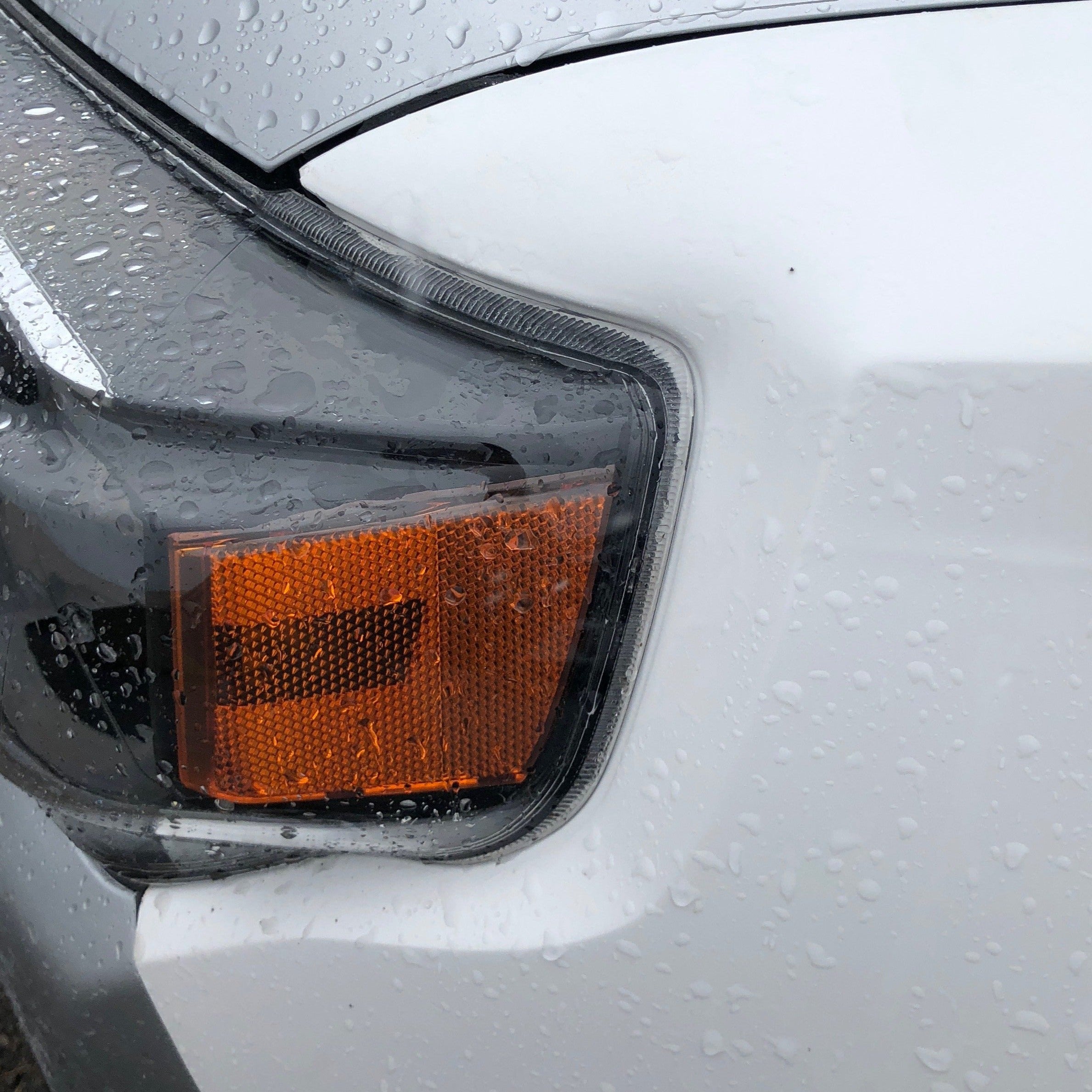 Toyota 4-Runner fender for 2010-2024 models, showcasing a sleek design with a rain-speckled surface.