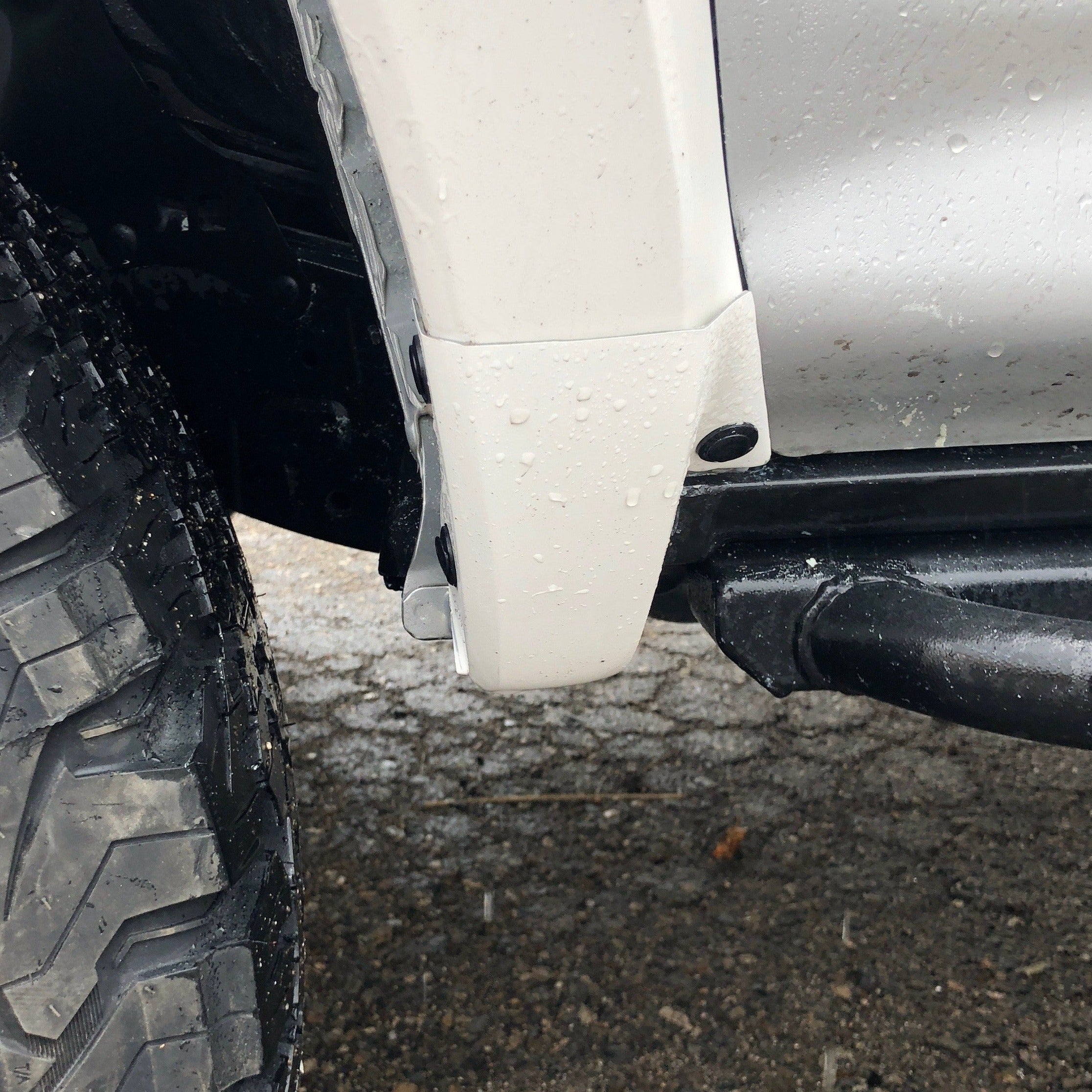 Close-up of a 2010-2024 Toyota 4-Runner fender showing a clean, durable design with rain droplets.