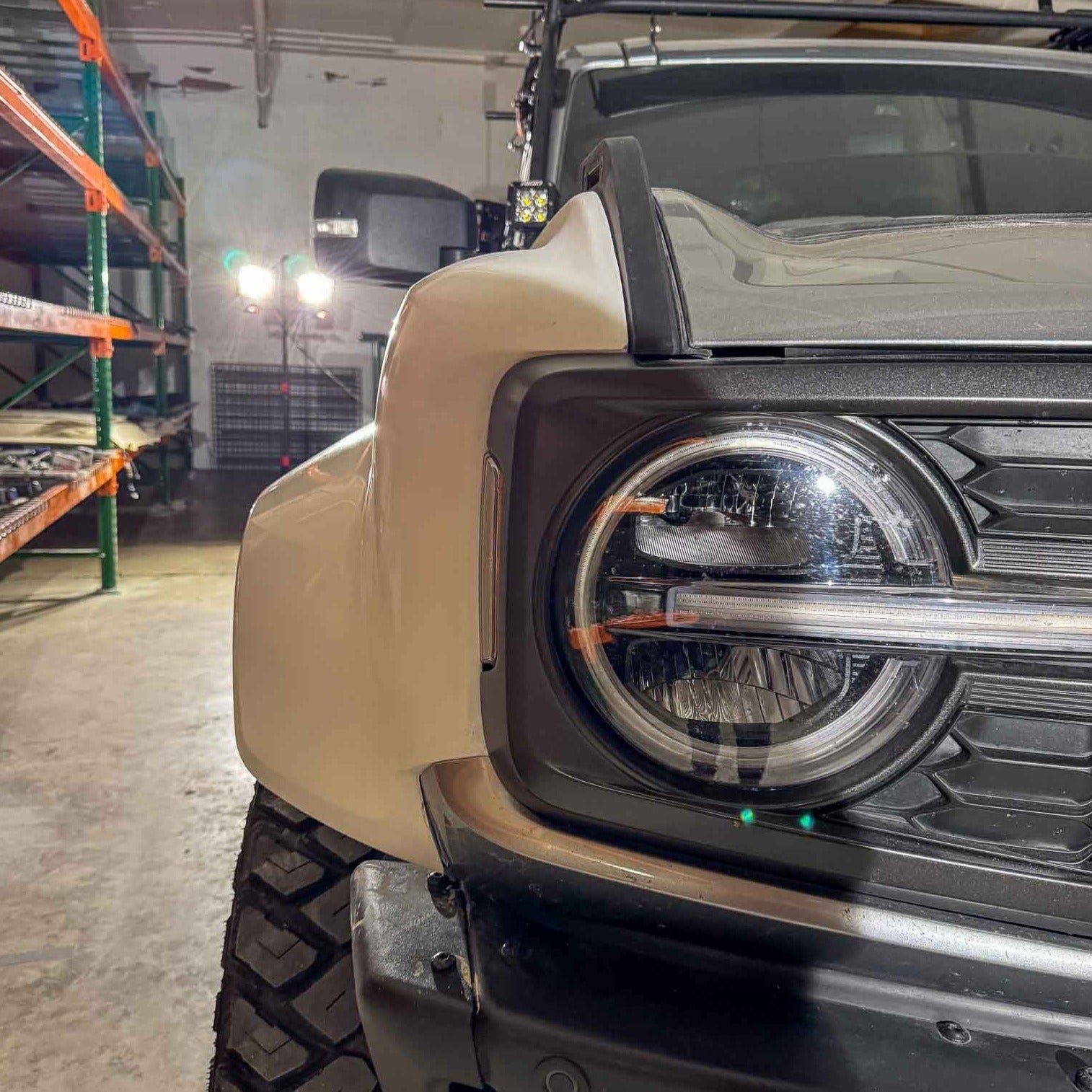 2022-2025 Ford Bronco Raptor fenders showcasing a close-up view of the front end and headlight design.