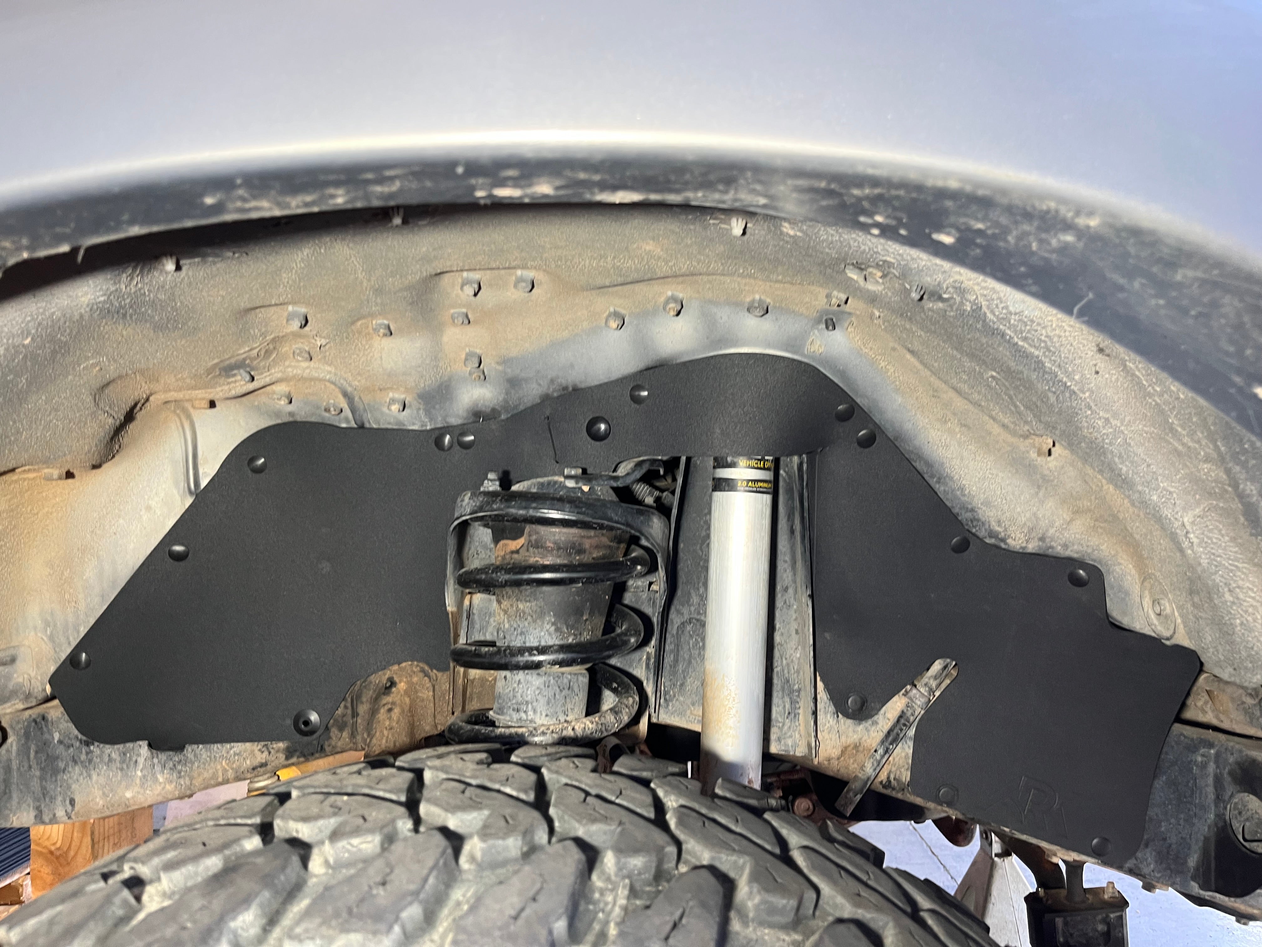 Splash guards for 1990-1998 Toyota Land Cruiser HDJ80, protecting undercarriage from debris and moisture.