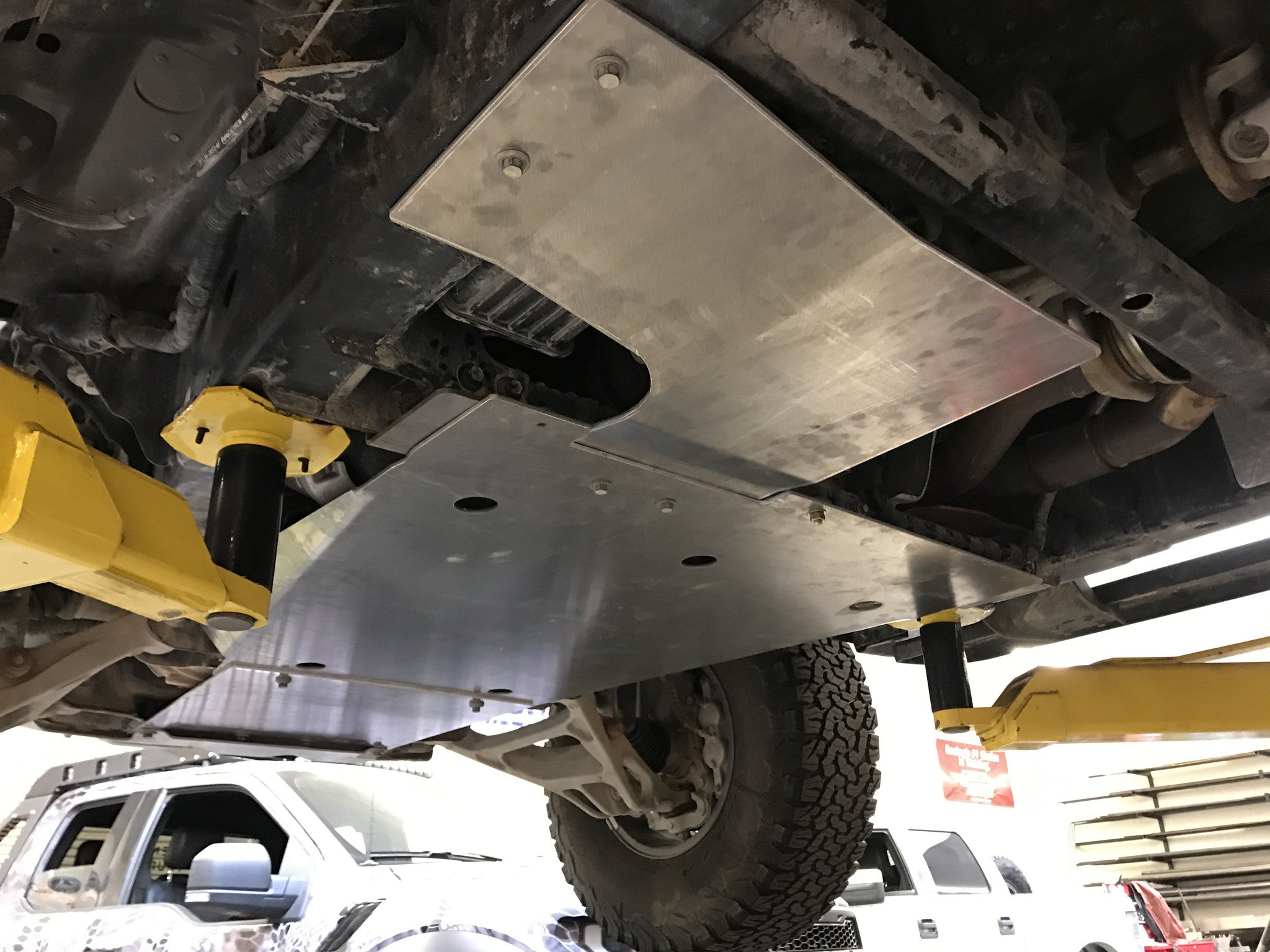 Skid plate kit for 2017-2024 Ford Raptor and Raptor-R, showcasing durable aluminum protection under the vehicle.
