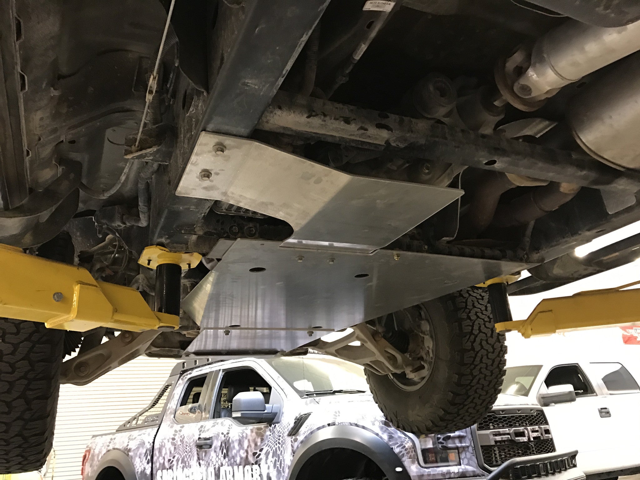 Skid plate kit for 2017-2024 Ford Raptor and Raptor-R, showcasing durable protection under the vehicle.