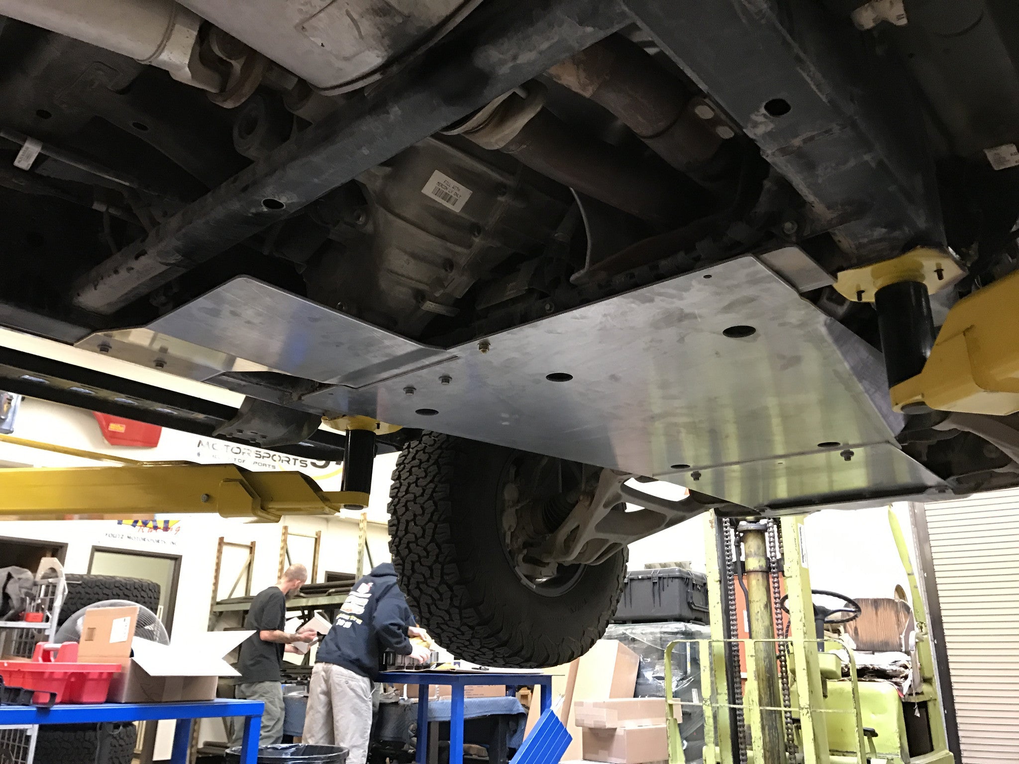 Skid plate kit installed under a 2017-2024 Ford Raptor, showcasing durable protection for off-road adventures.