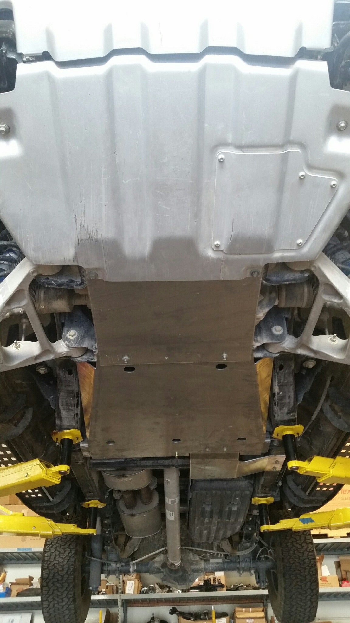 Skid plate kit installed on a 2017-2024 Ford Raptor, showcasing undercarriage protection for off-road durability.