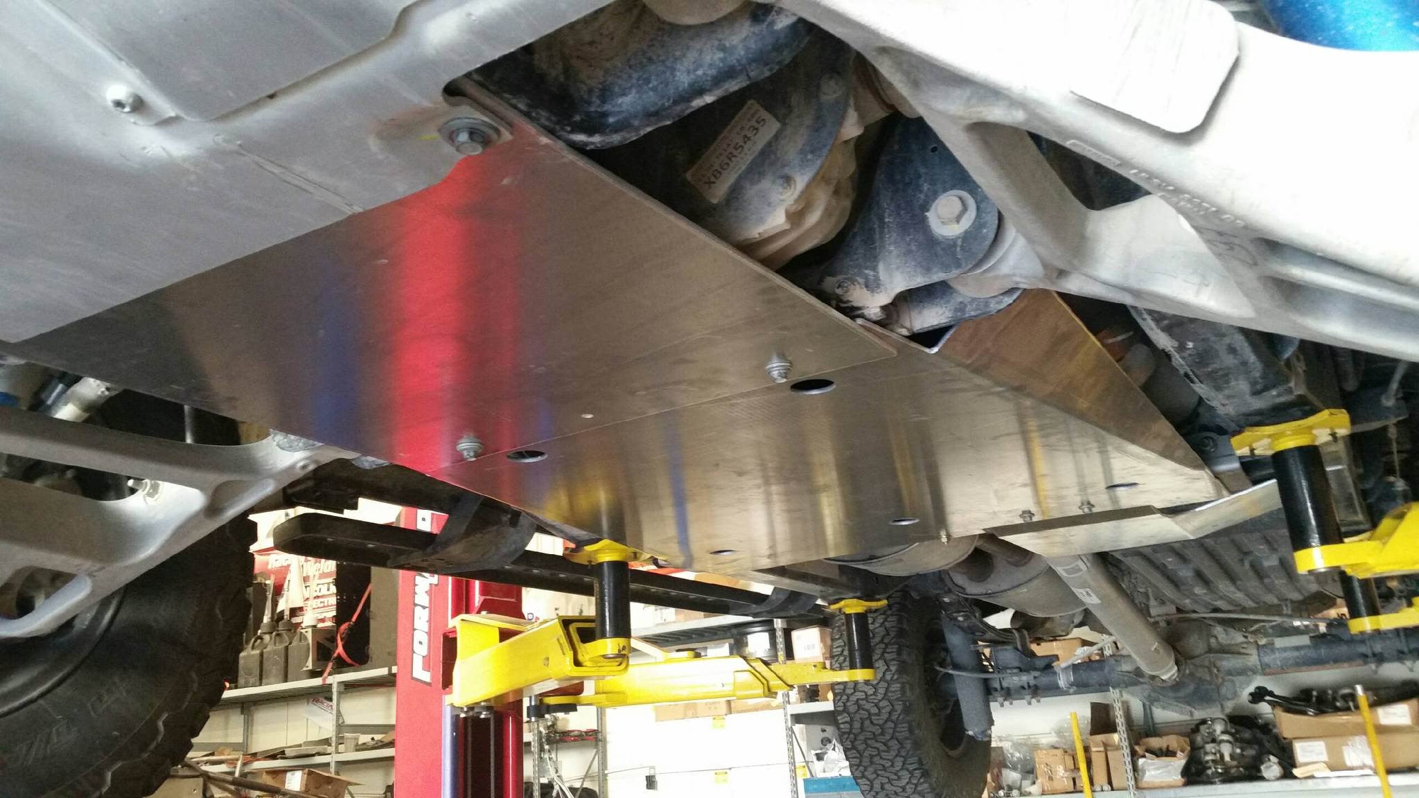 Skid plate kit installed on a 2017-2024 Ford Raptor, providing undercarriage protection for off-road adventures.