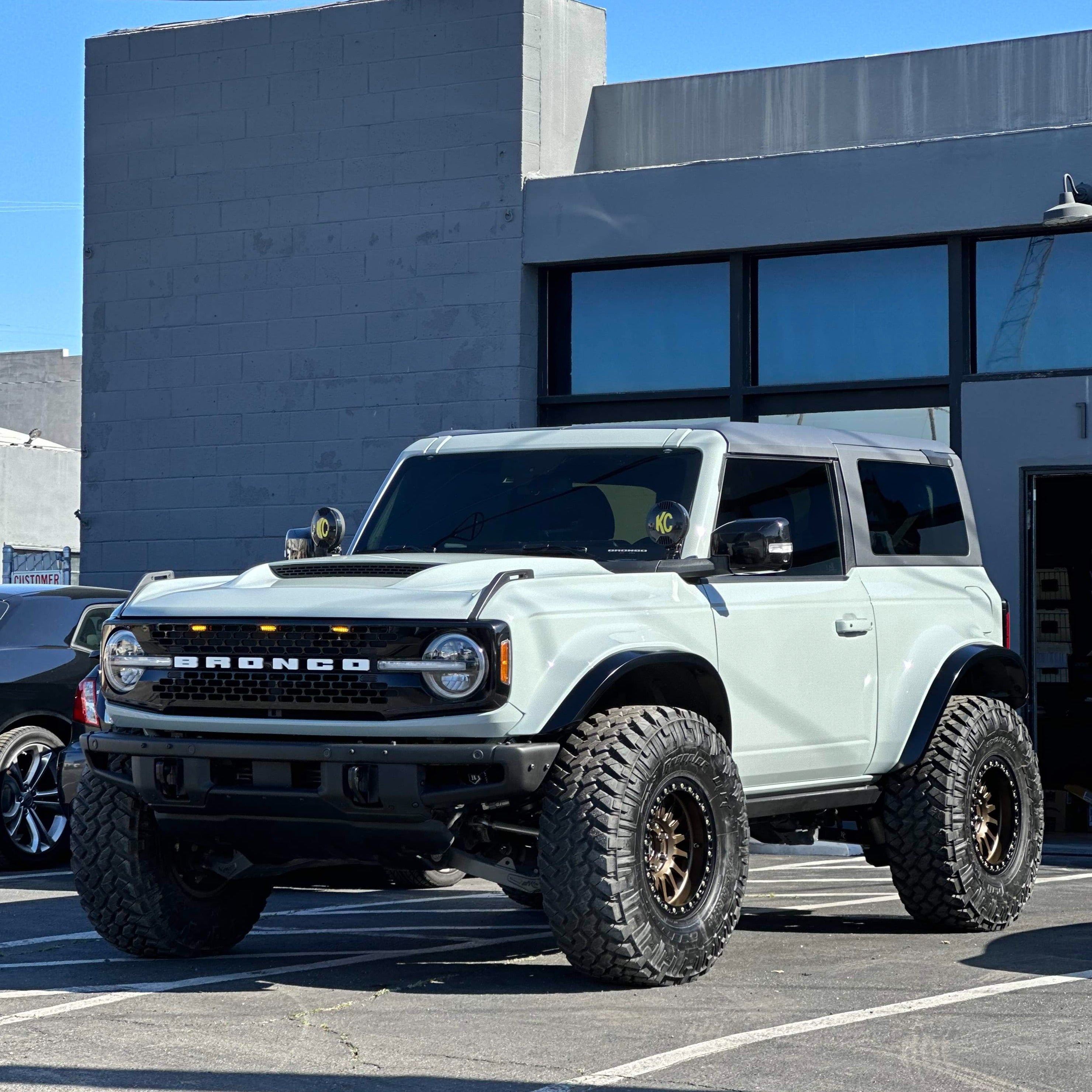 2021-2025 Ford Bronco 2-Door Rear Quarter Kit displayed on a modified Bronco with offroad tires and a rugged design.