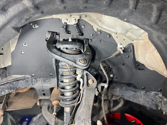 2019-2024 Ford Ranger splash guards installed, showcasing suspension components and undercarriage protection.