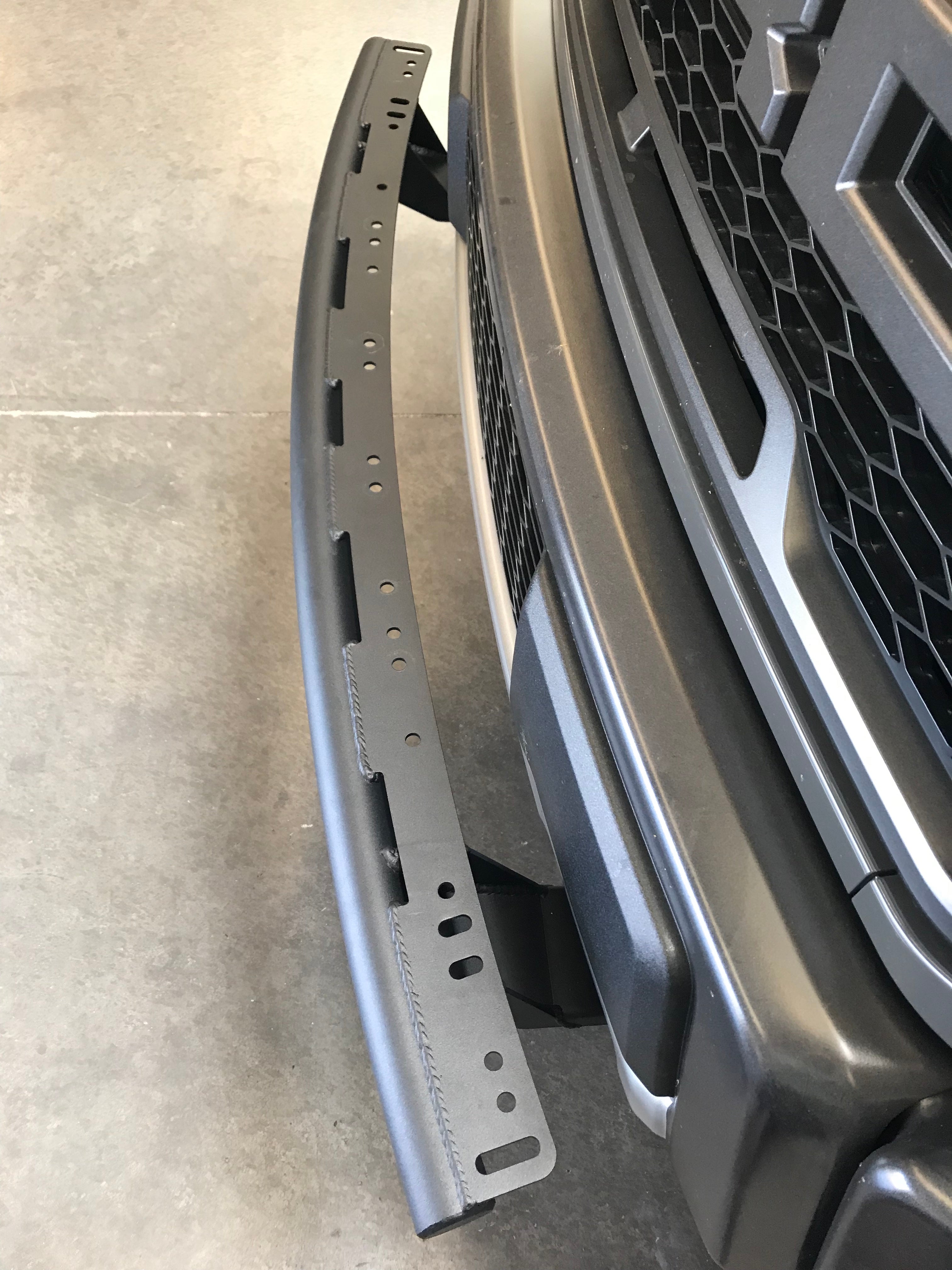 Single tube light mount for 2015+ Ford F150 and 2017+ Raptor, designed for stock bumpers, featuring a durable black finish.