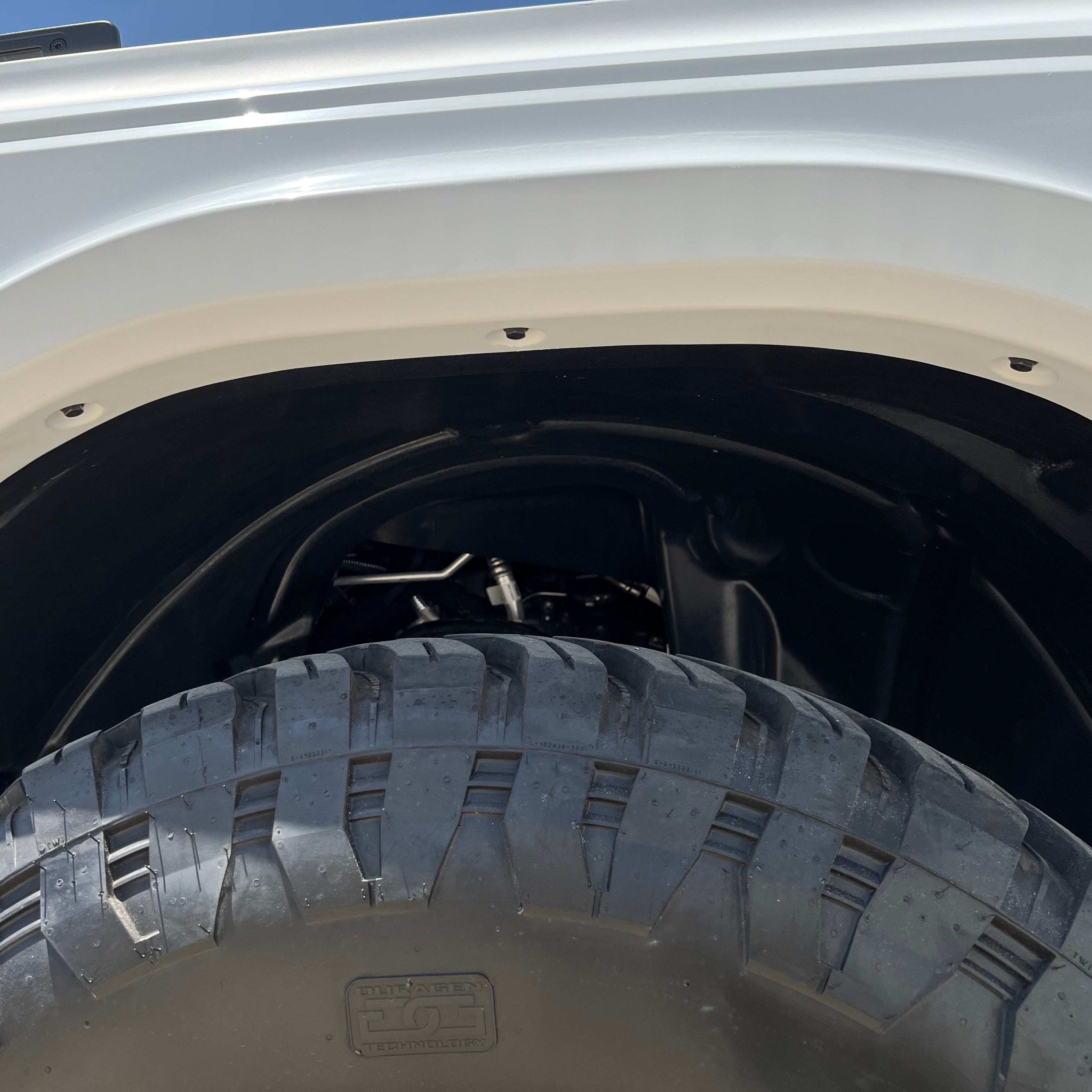 2021-2025 Ford Bronco fenders showcasing a close-up view of the wheel well and rugged tire for offroad performance.