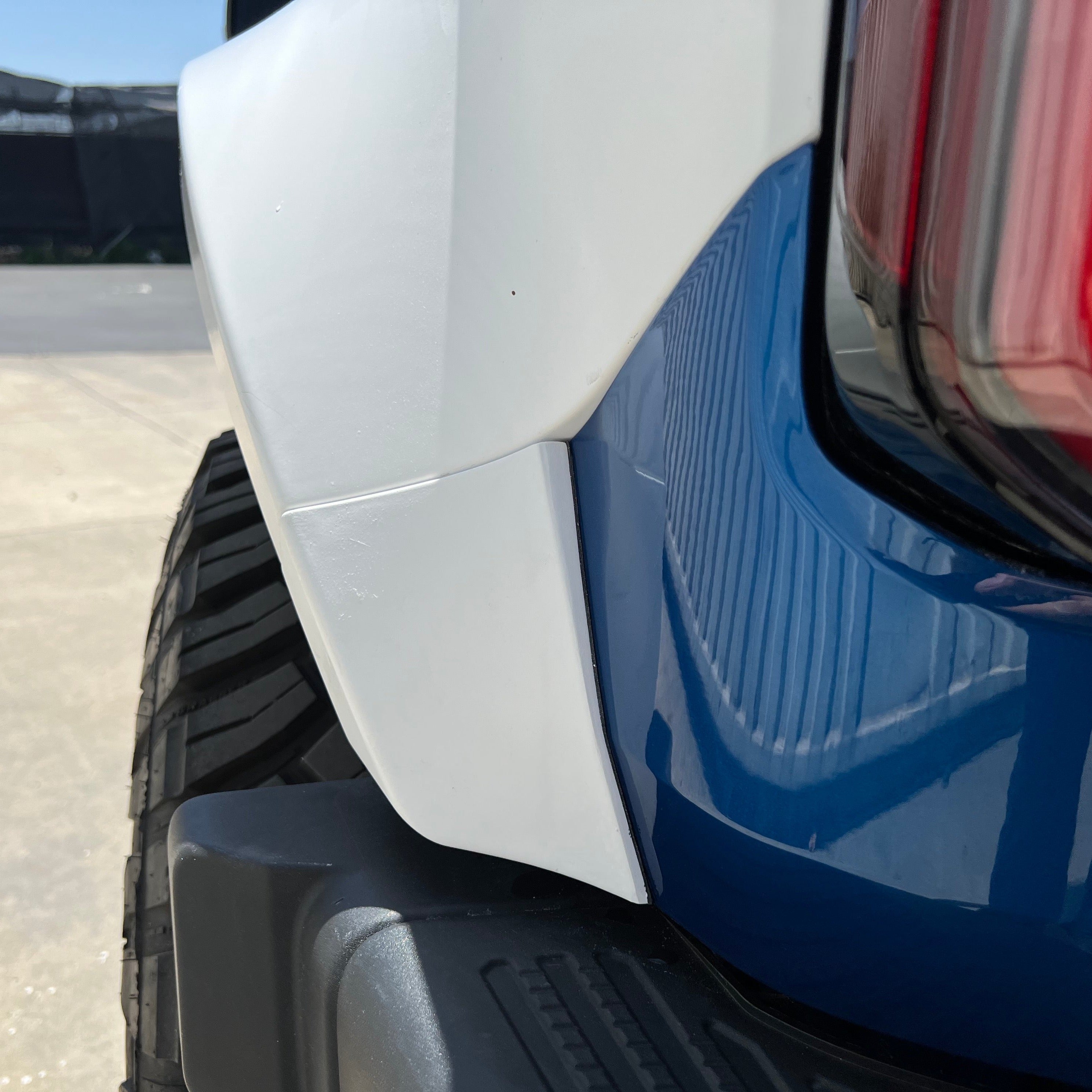 2021-2025 Ford Bronco 4-Door Rear Quarter Kit showing the rear fender flare design and fit on a blue vehicle.