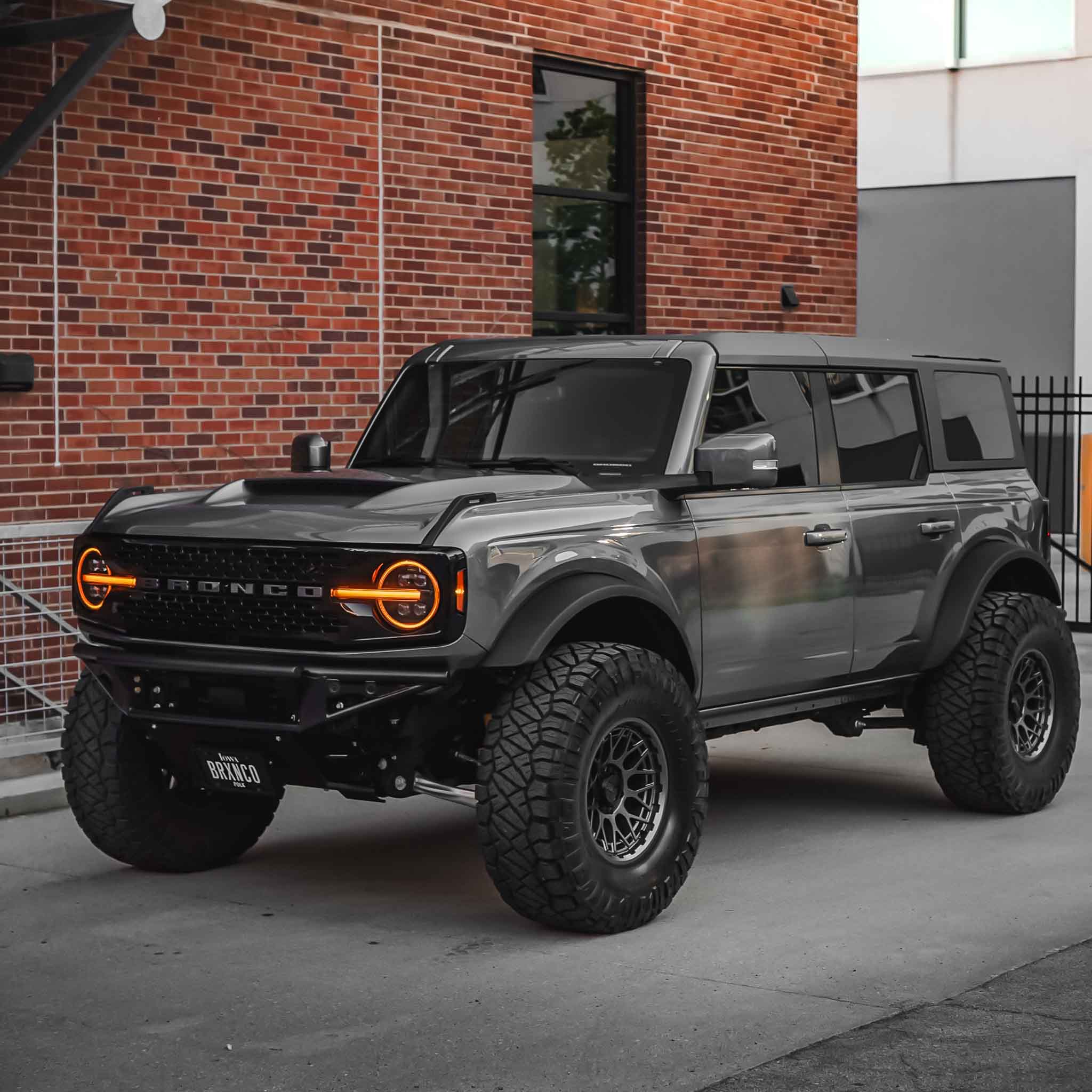 2021-2025 Ford Bronco with a Ram Air Hood, showcasing rugged design and off-road capabilities in an urban setting.