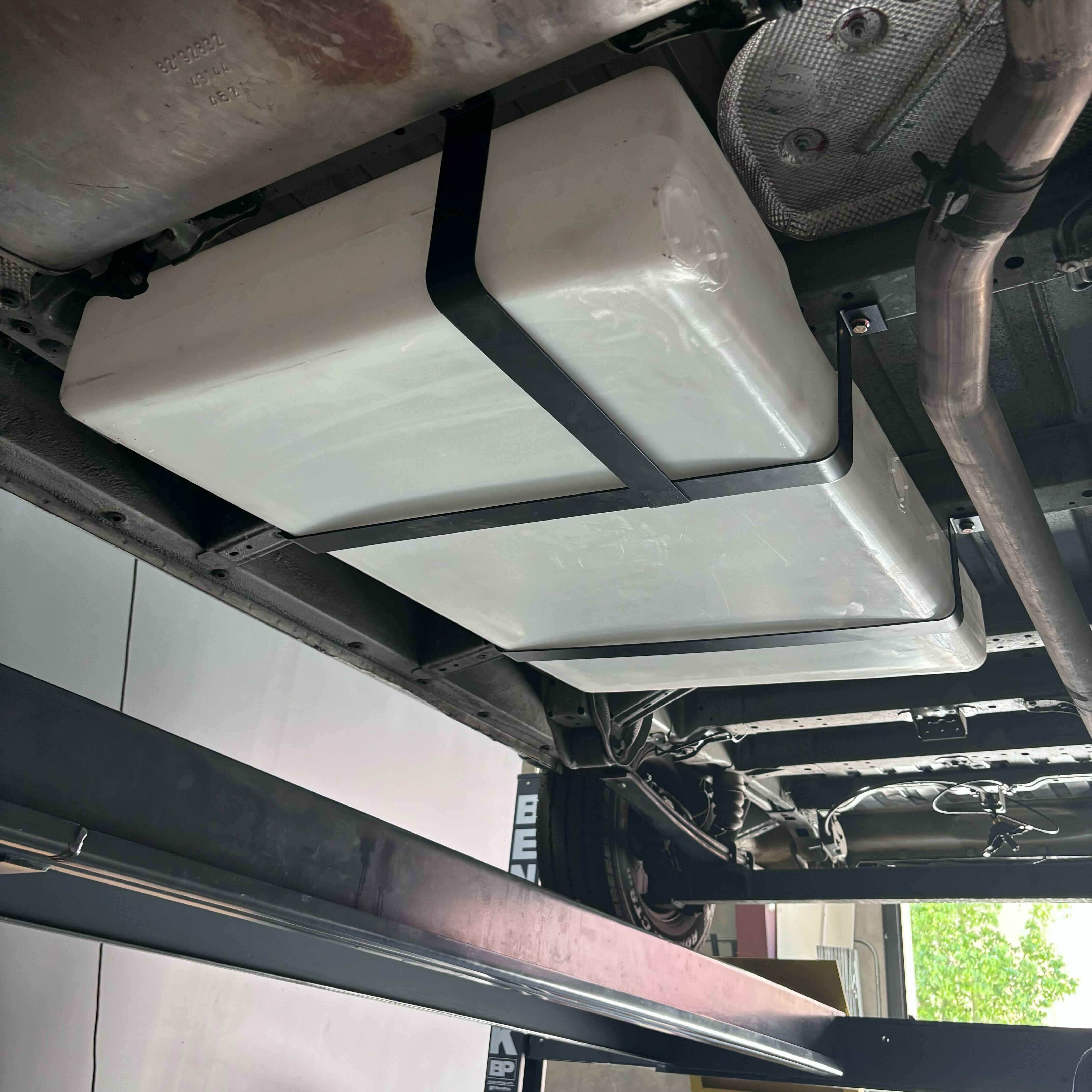 36-gallon undercarriage fresh and grey water tank installed on a Ford or Dodge Ram Promaster, showcasing secure mounting.