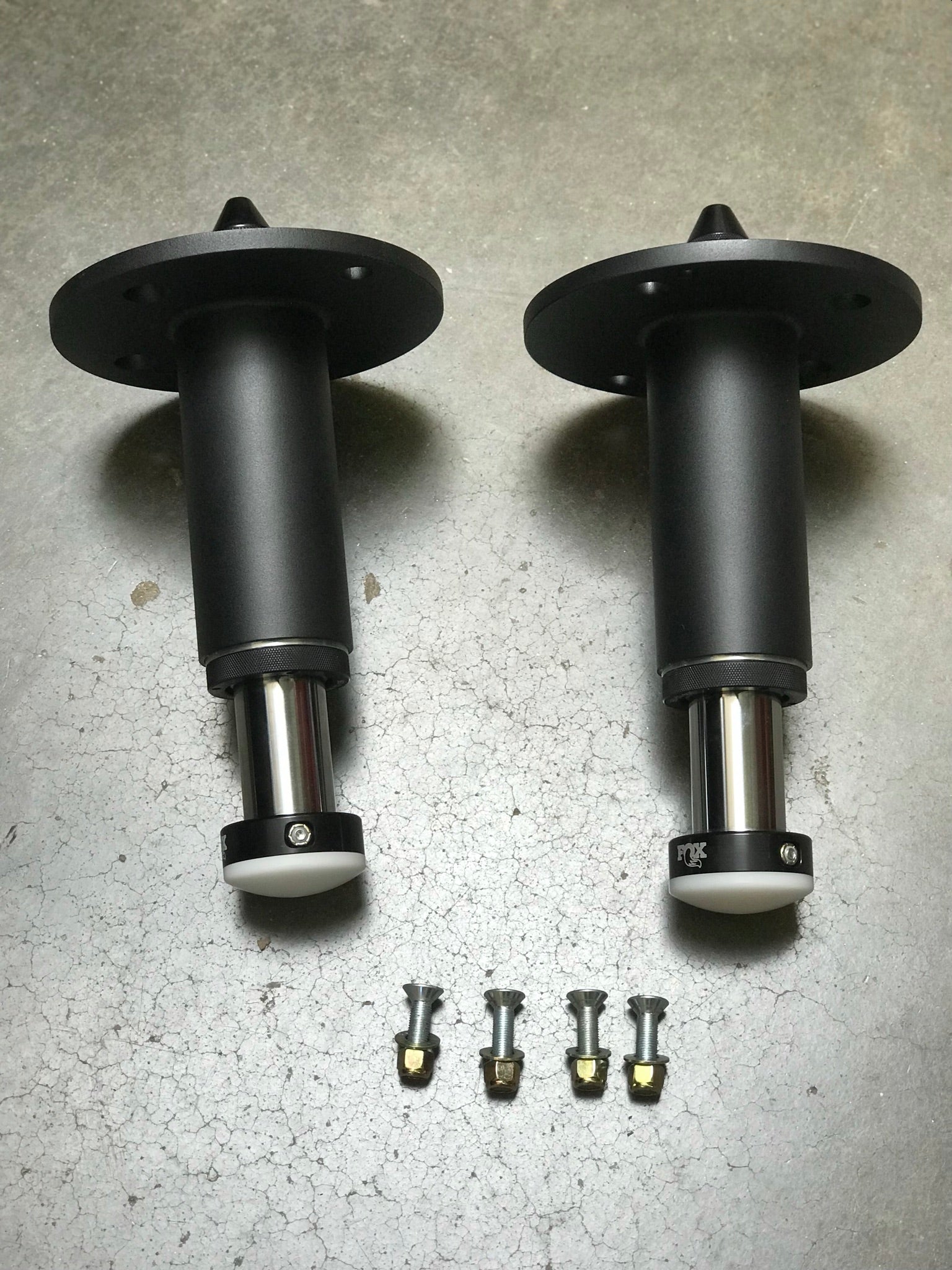 2021 and up Ram TRX rear bump stop kit featuring hydraulic bump stops and installation hardware by Foutz Motorsports.