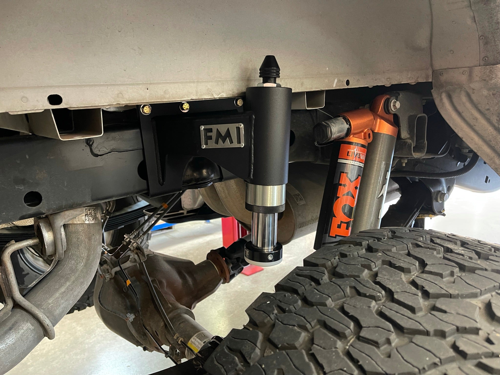 Rear bump stop kit for 2017-2020 Raptor and 2015-2024 F150, showcasing installation with Fox shocks and durable components.