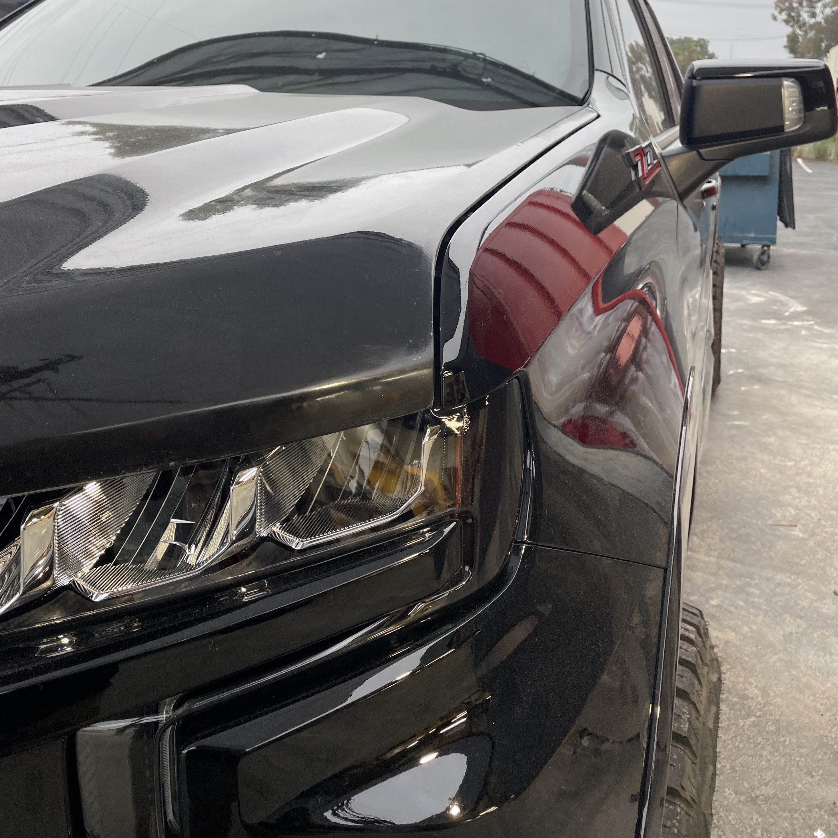 2019-2025 Chevrolet Silverado hood showcasing sleek design and modern styling, highlighting its robust front profile.