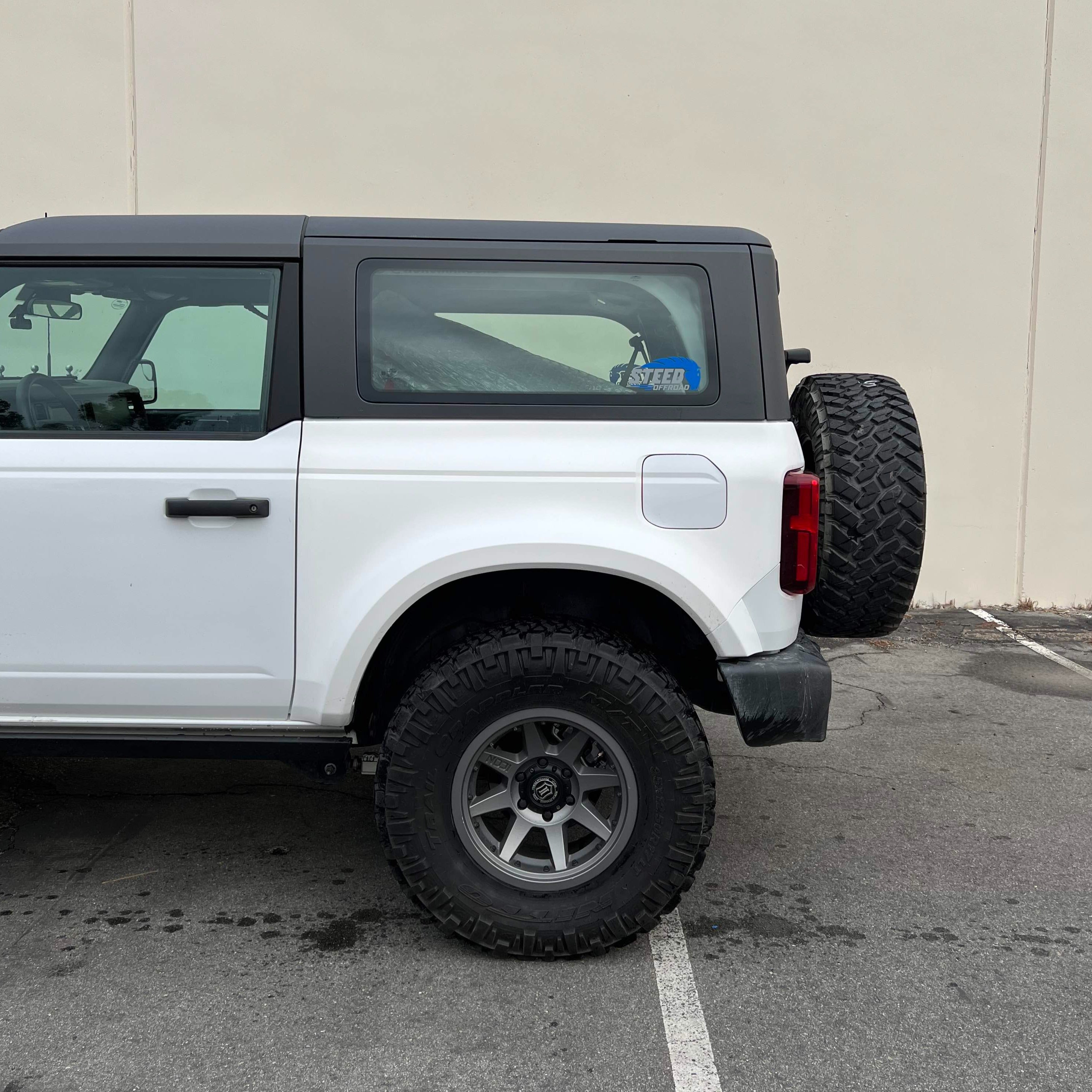 2021-2025 Ford Bronco 2-Door Rear Quarter Kit installed on a white Bronco, showcasing its rugged design and off-road capabilities.