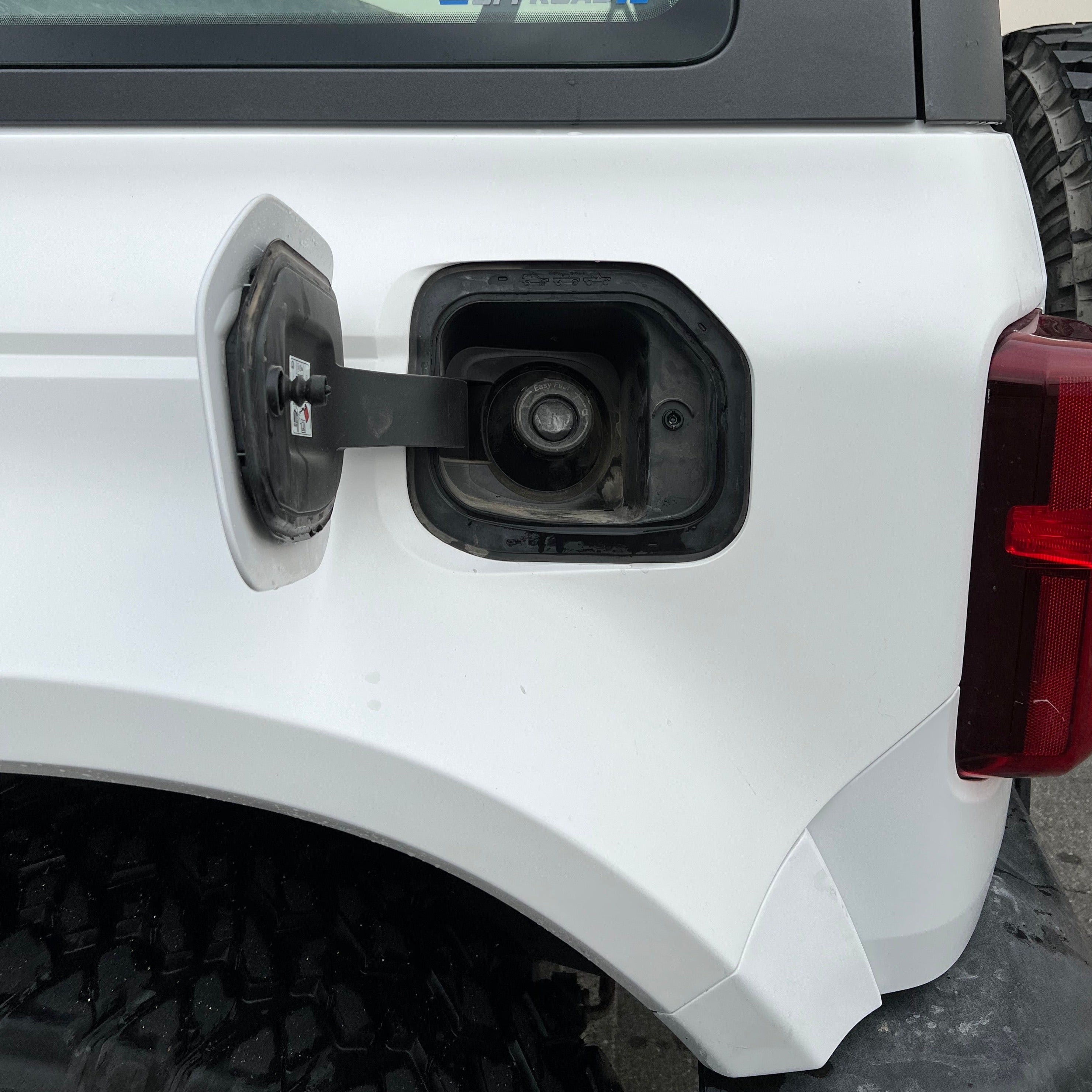2021-2025 Ford Bronco 2-Door Rear Quarter Kit showcasing the fuel filler area on a white vehicle.
