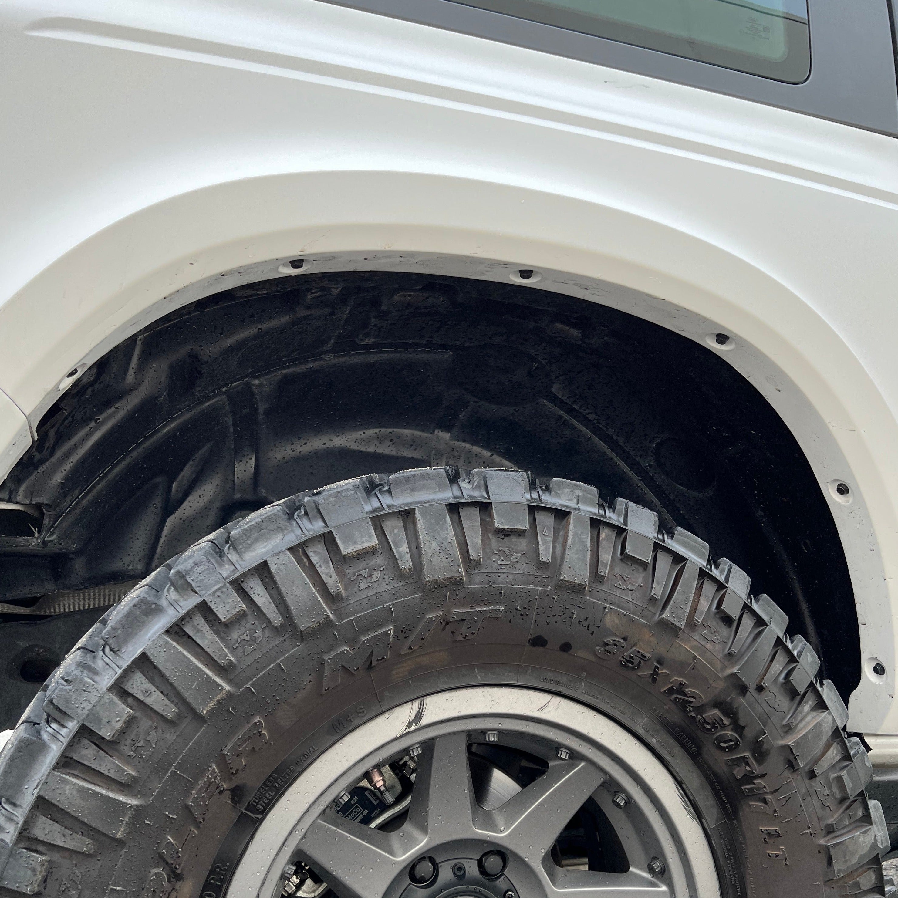 2021-2025 Ford Bronco 2-Door Rear Quarter Kit showcasing the wheel well and rugged tire for off-road performance.