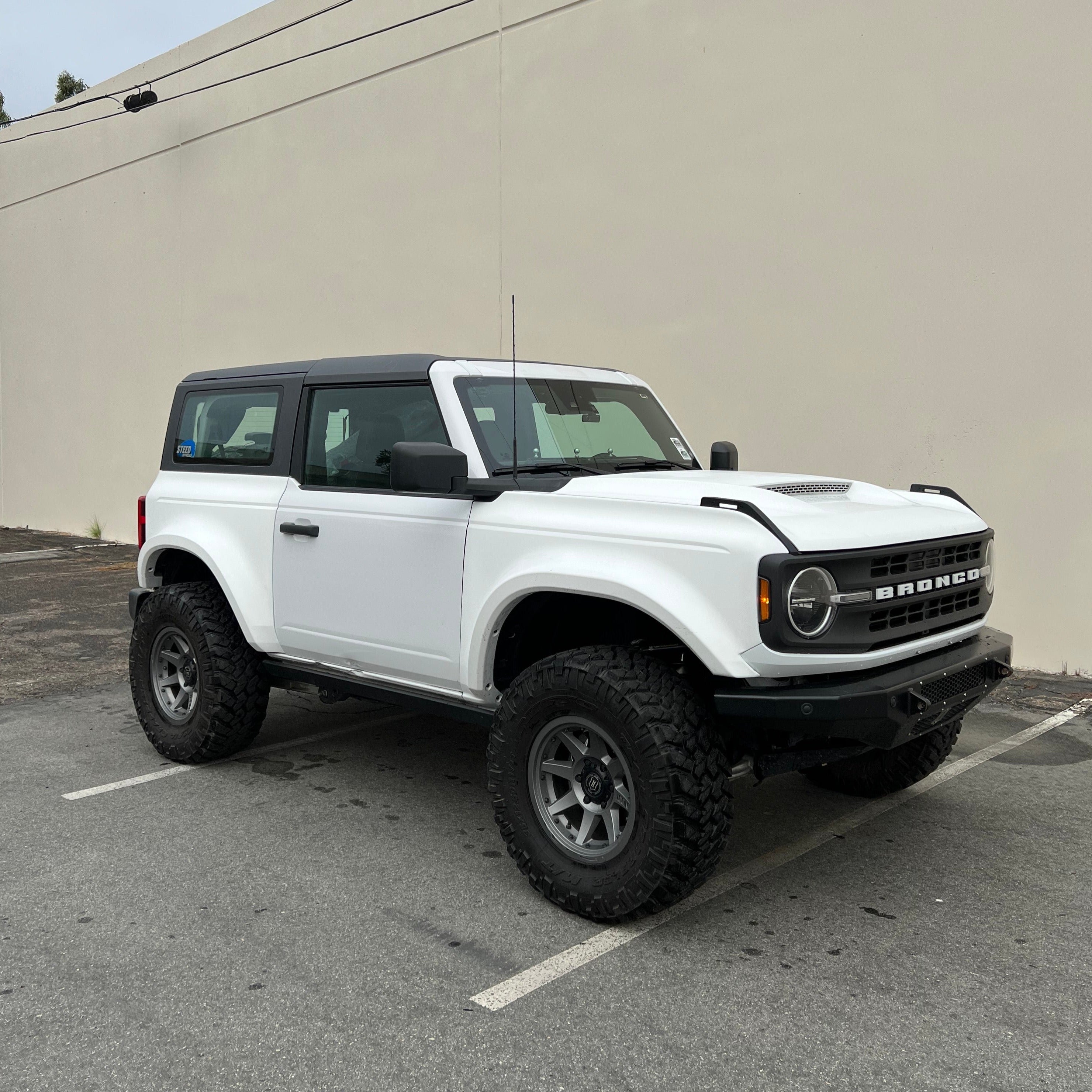 2021-2025 Ford Bronco 2-Door Rear Quarter Kit displayed on a modified white Bronco with off-road tires.